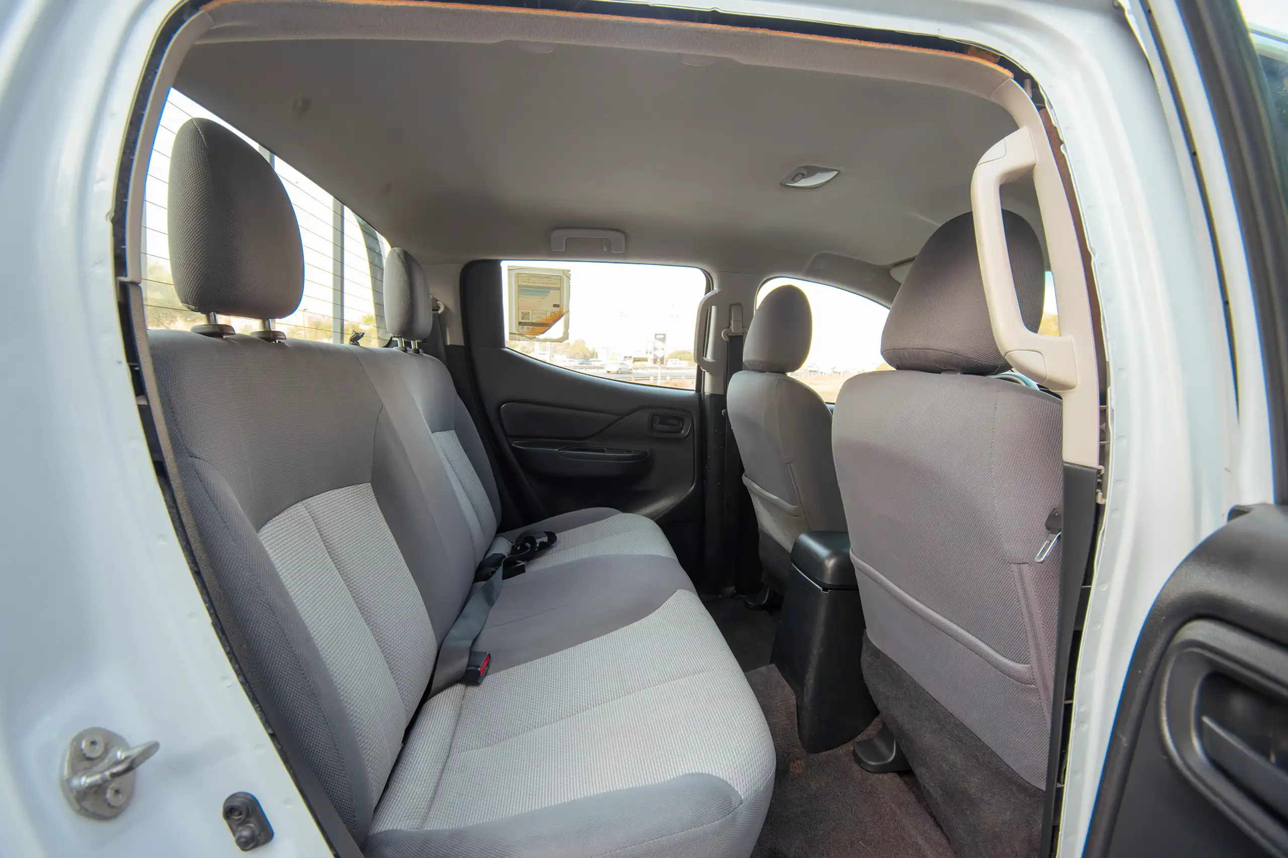 Used 2020 Mitsubishi L200 GLX Double Cabin White – Rear Passenger Side Cabin View at First Choice Cars Sharjah