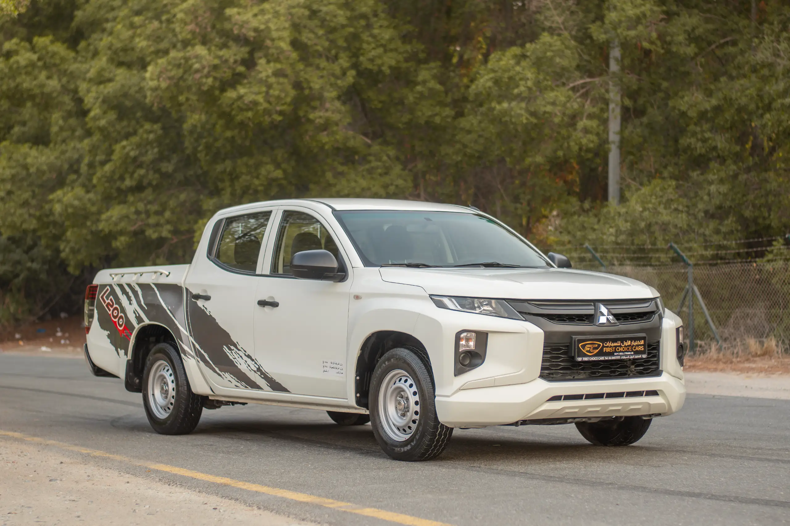 Used 2021 Mitsubishi L200 GL Double Cabin White – Right Front Diagonal (45°) View at First Choice Cars Sharjah