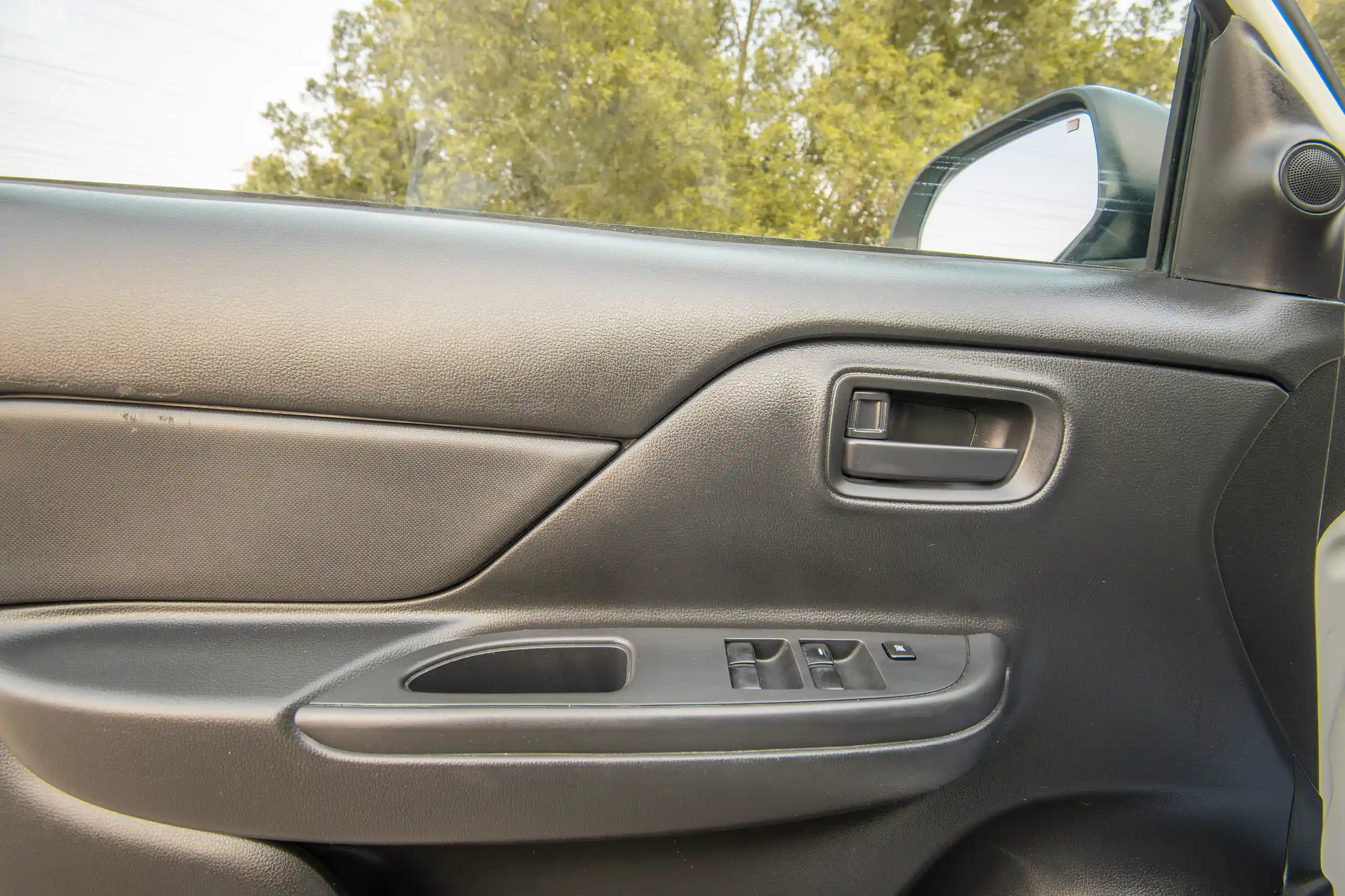 Used 2021 Mitsubishi L200 GL Double Cabin White – Driver Door Panel Full View at First Choice Cars Sharjah