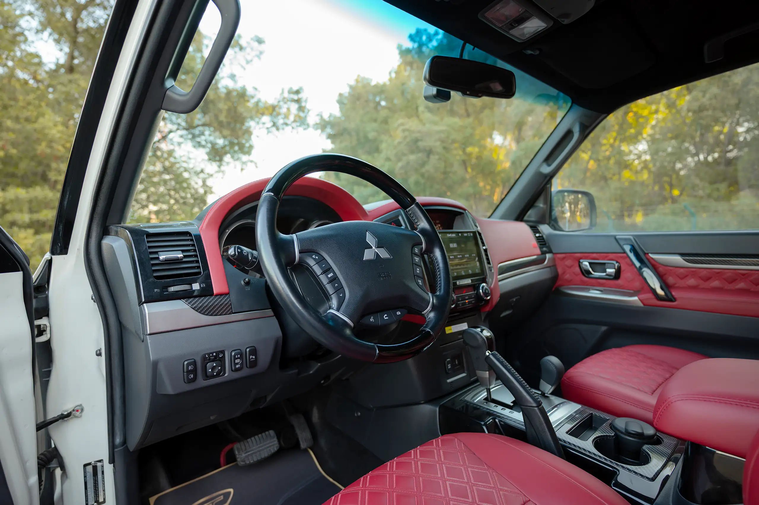 Used 2020 Mitsubishi Pajero Signature Edition White – Driver Side Dashboard & Steering View at First Choice Cars Sharjah