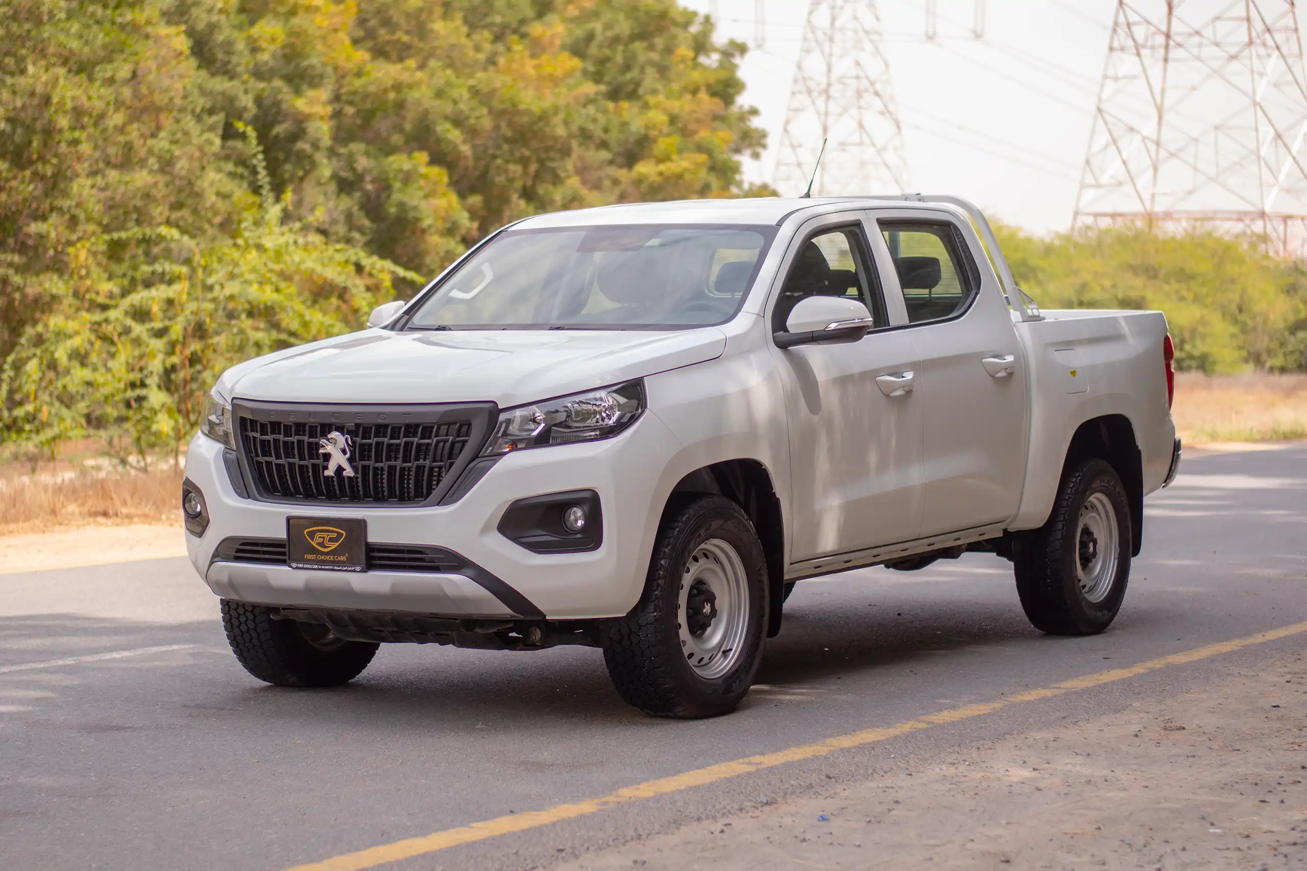 Used 2023 Peugeot Landtrek Double Cabin White – Left Front Diagonal (45°) View at First Choice Cars Sharjah