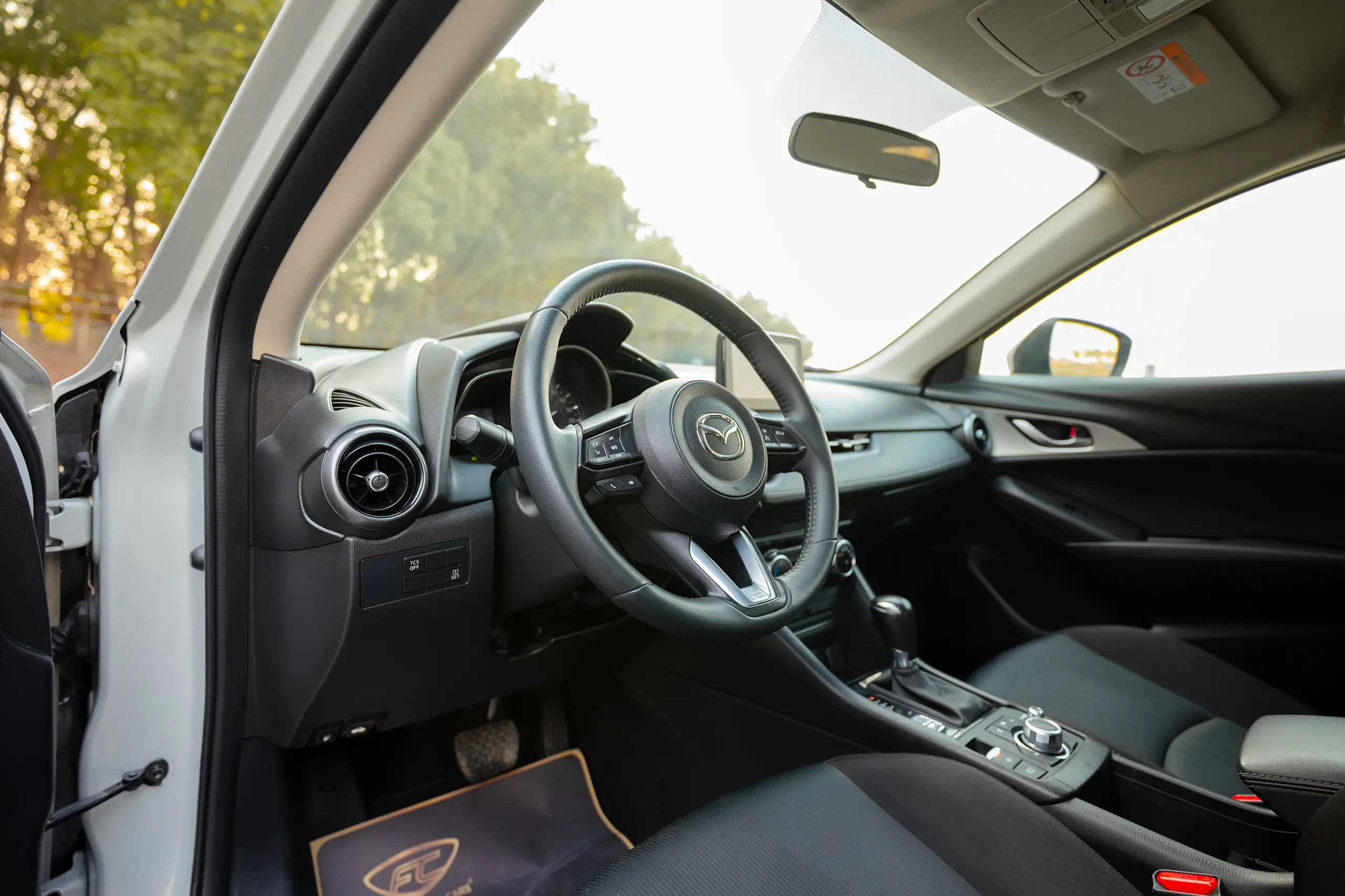 Used 2021 Mazda CX-3 GS Silver – Driver Side Dashboard & Steering View at First Choice Cars Sharjah