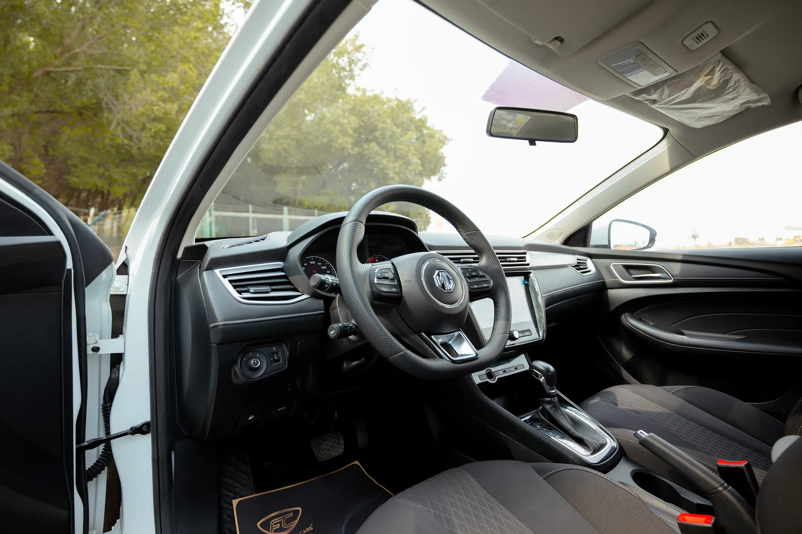 Used 2024 MG 5 Comfort White – Driver Side Dashboard & Steering View at First Choice Cars Sharjah