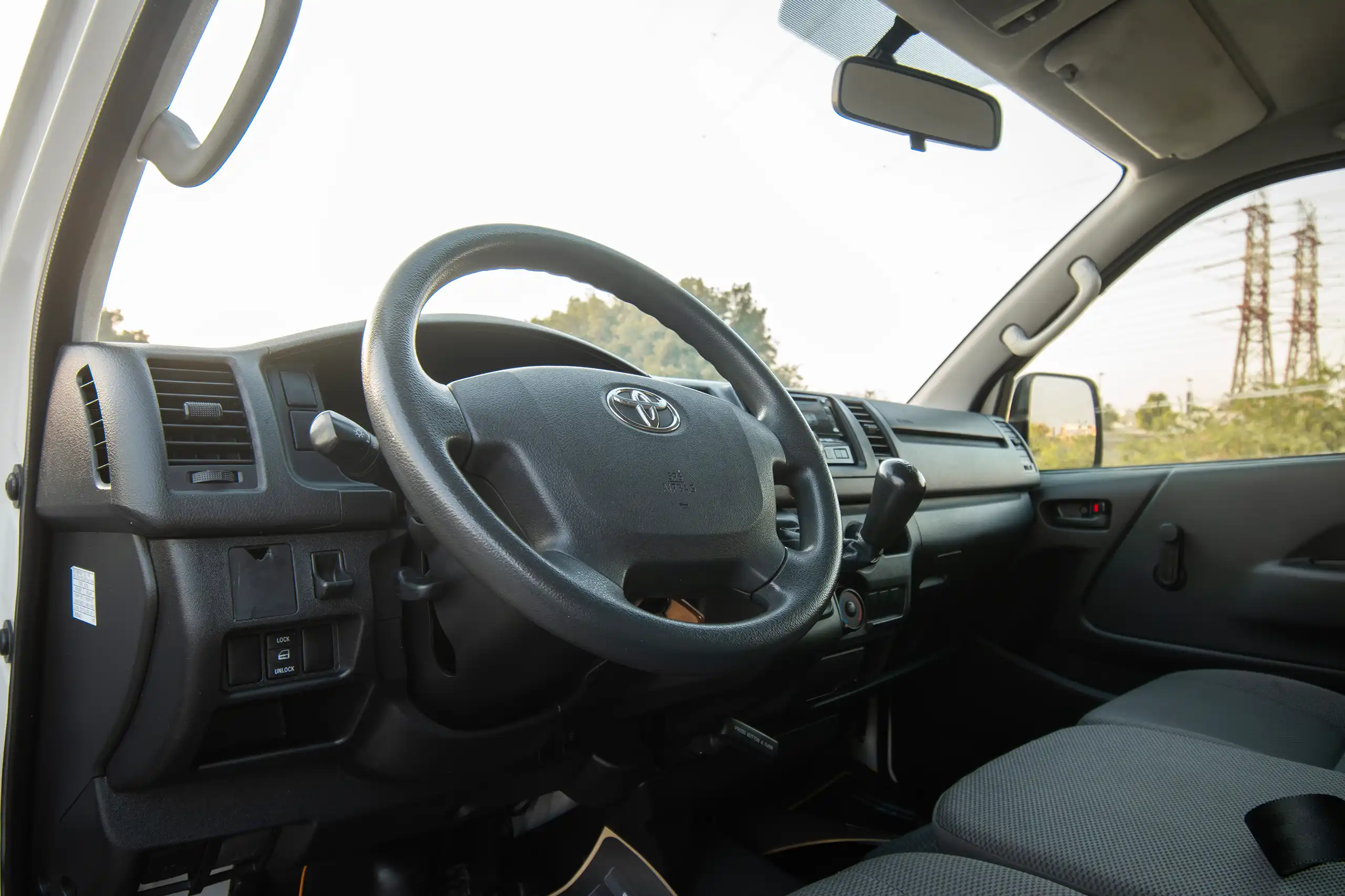 Used 2022 Toyota Hiace GL Standard Roof White – Driver Side Dashboard & Steering View at First Choice Cars Sharjah