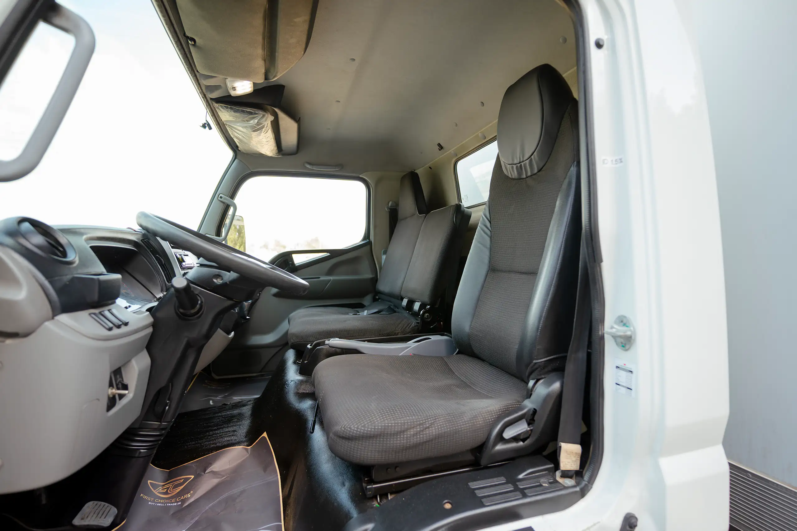 Used 2020 Mitsubishi Canter Chiller Box White – Front Driver Side Cabin View at First Choice Cars Sharjah