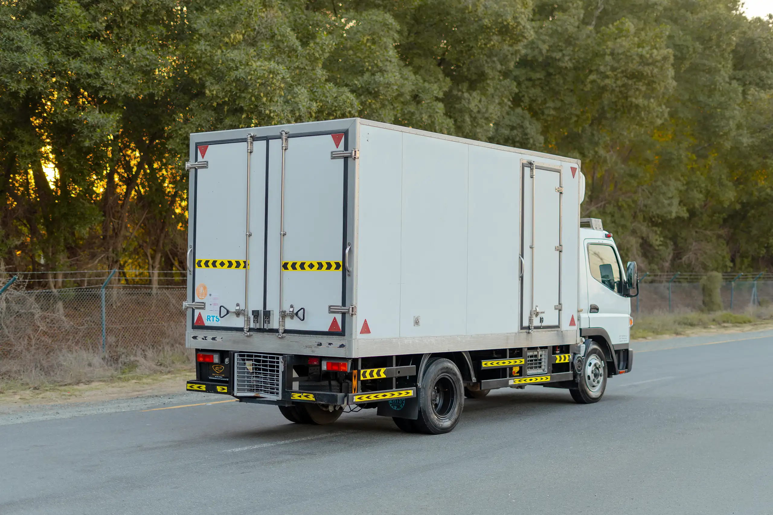 Used 2020 Mitsubishi Canter Chiller Box White – Right Back Diagonal (45°) View at First Choice Cars Sharjah