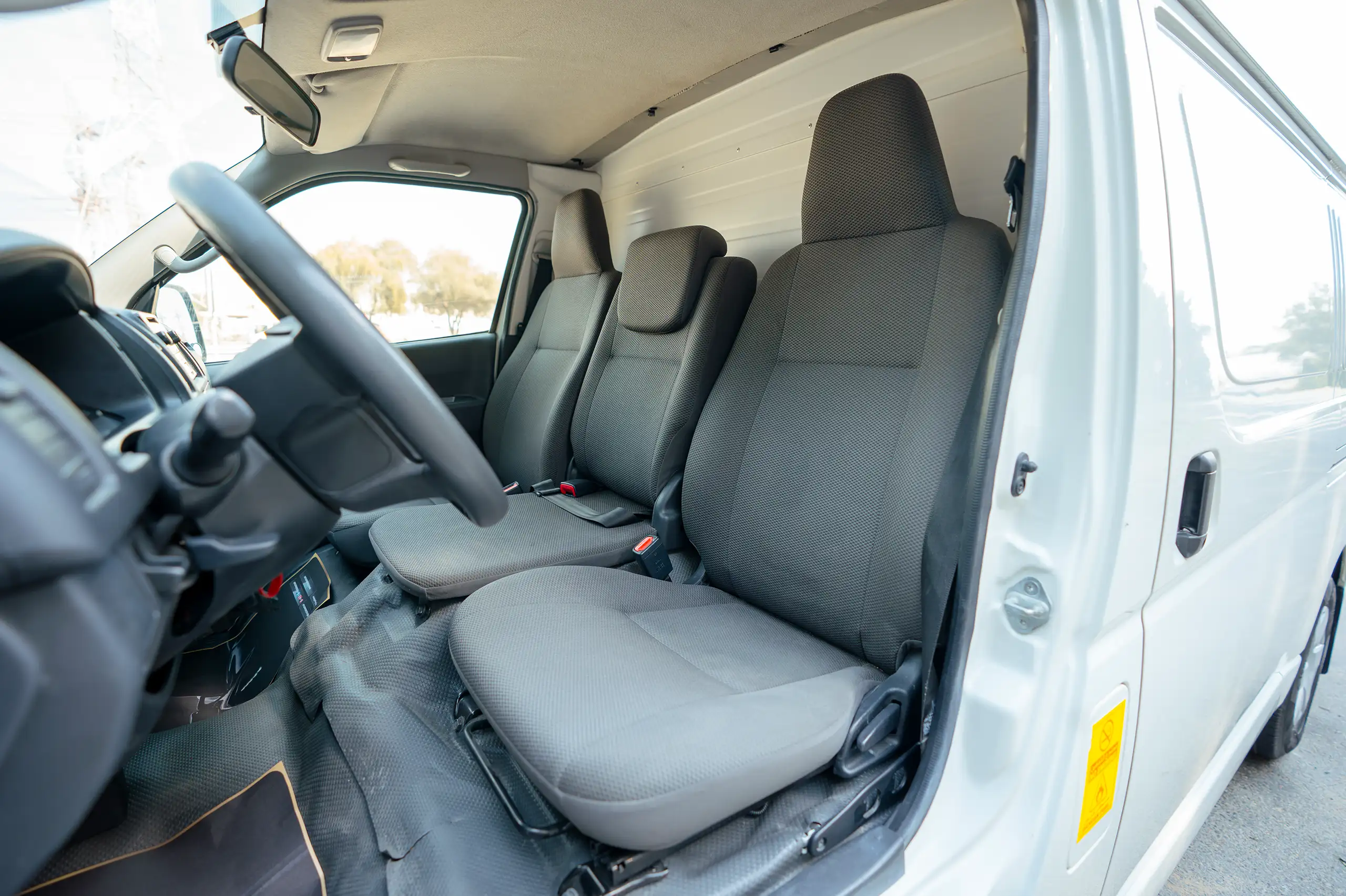 Used 2023 Toyota Hiace GL Standard Roof White – Front Driver Side Cabin View at First Choice Cars Sharjah