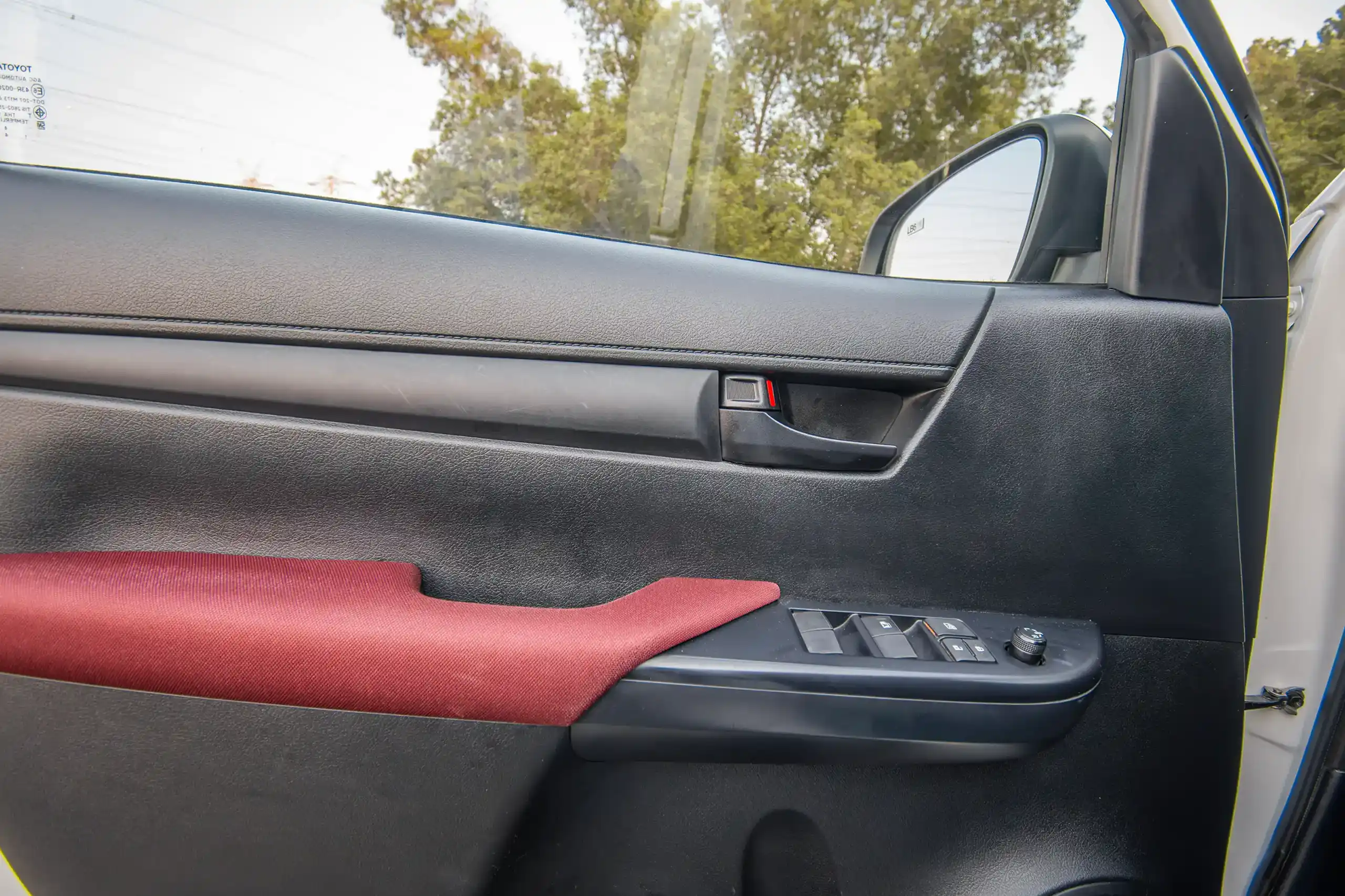 Used 2024 Toyota Hilux GLX Double Cabin White – Driver Door Panel Full View at First Choice Cars Sharjah