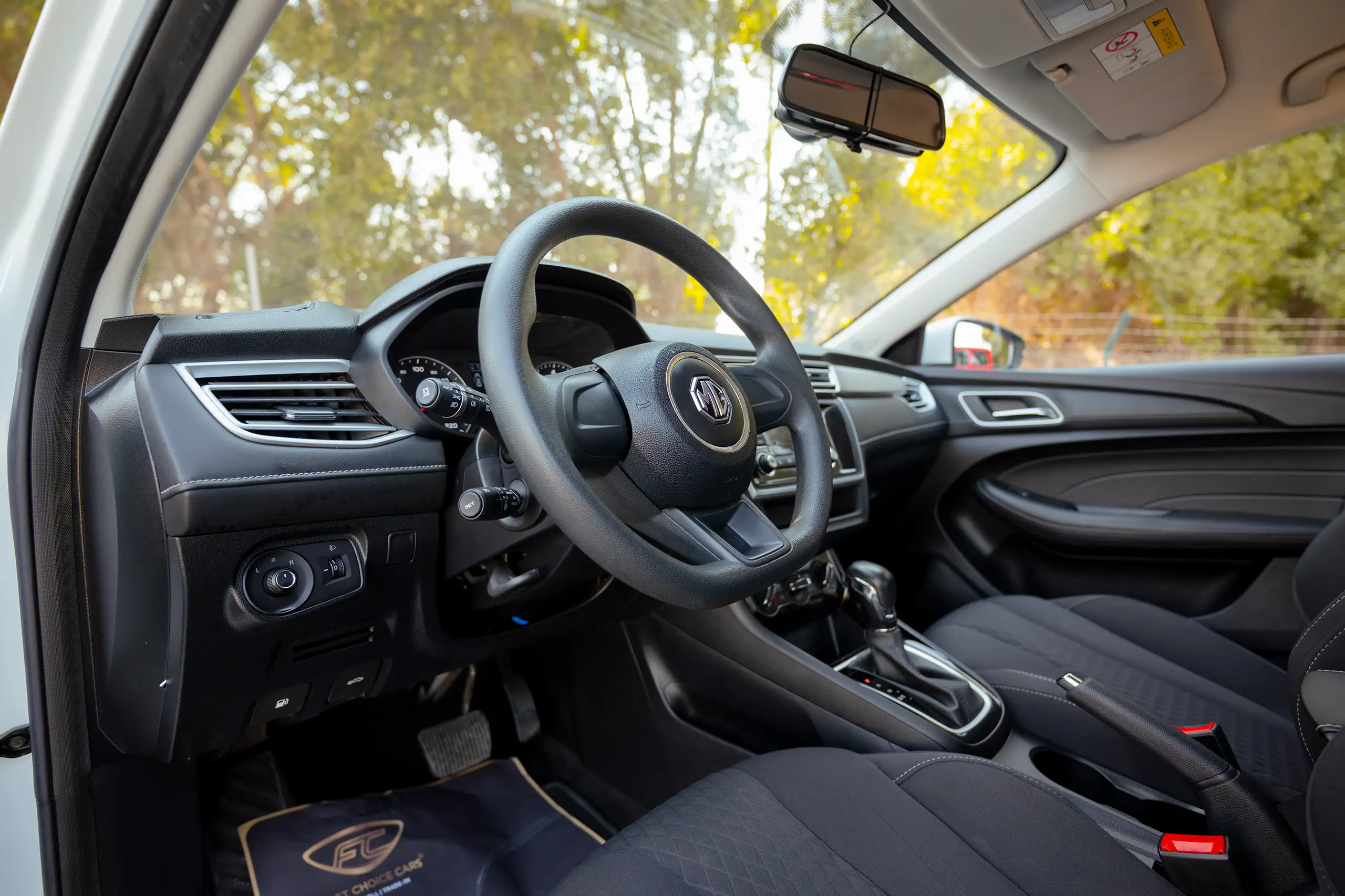 Used 2023 MG 5 Comfort White – Driver Side Dashboard & Steering View at First Choice Cars Sharjah