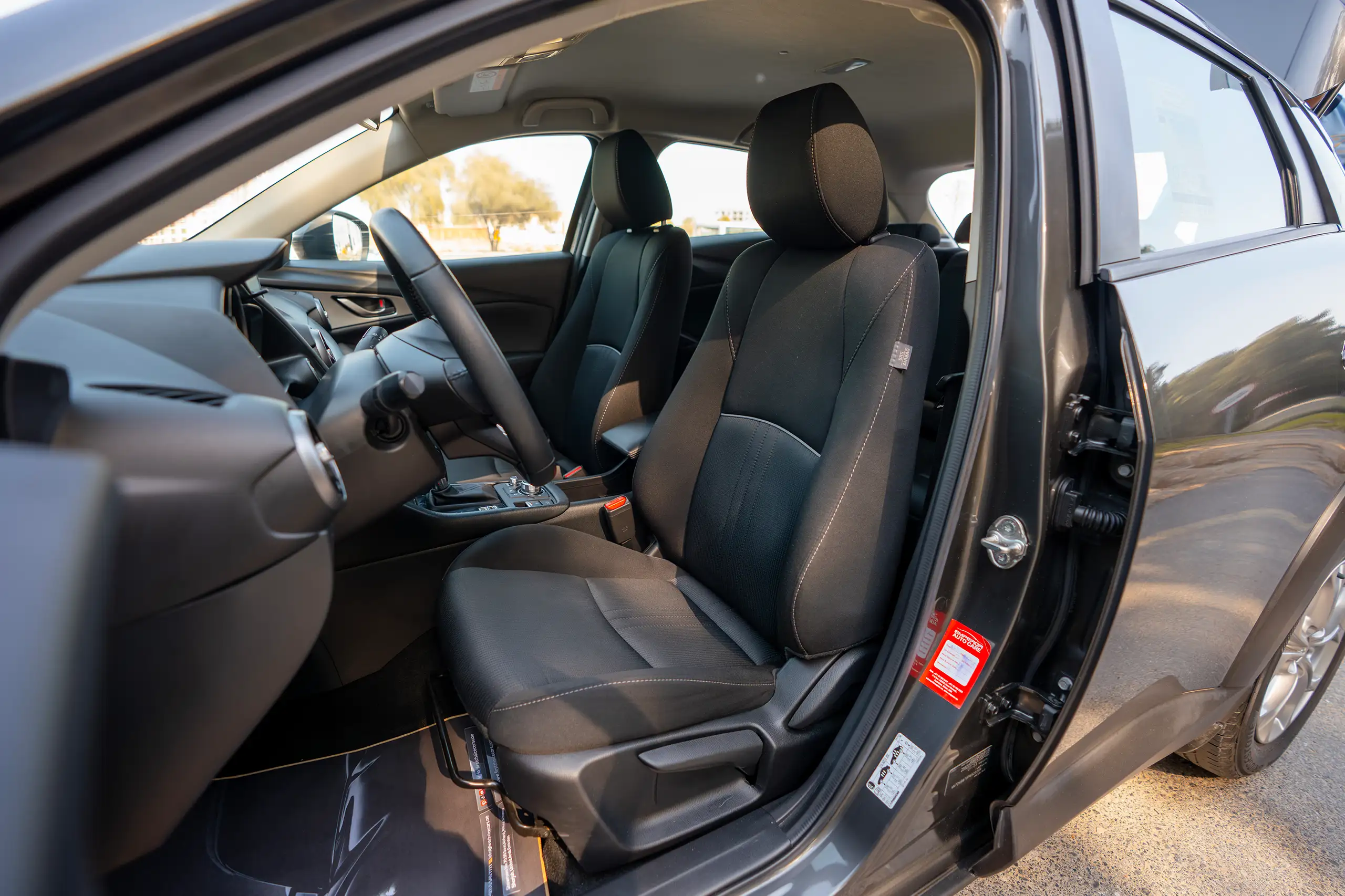 Used 2023 Mazda CX-3 GS Grey – Front Driver Side Cabin View at First Choice Cars Sharjah