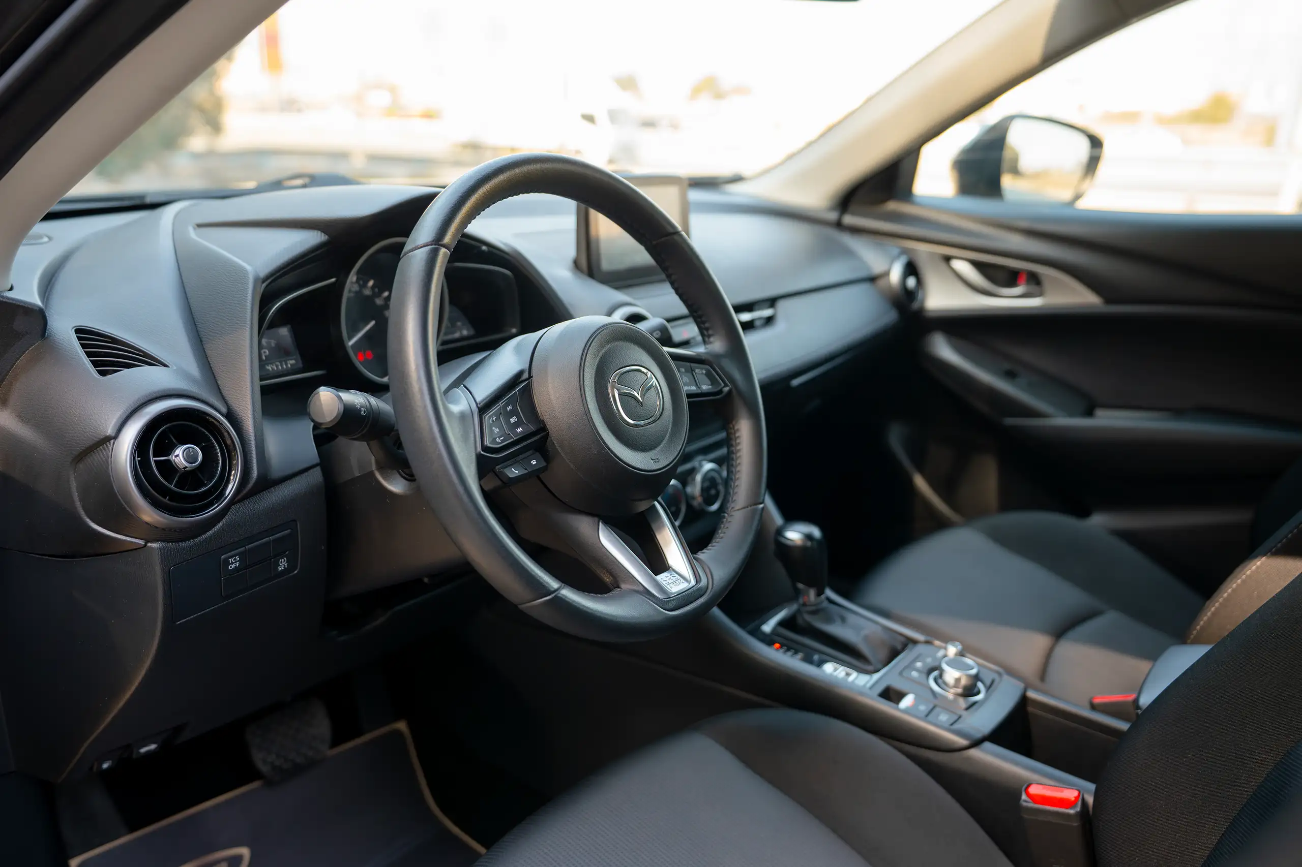 Used 2023 Mazda CX-3 GS Grey – Driver Side Dashboard & Steering View at First Choice Cars Sharjah
