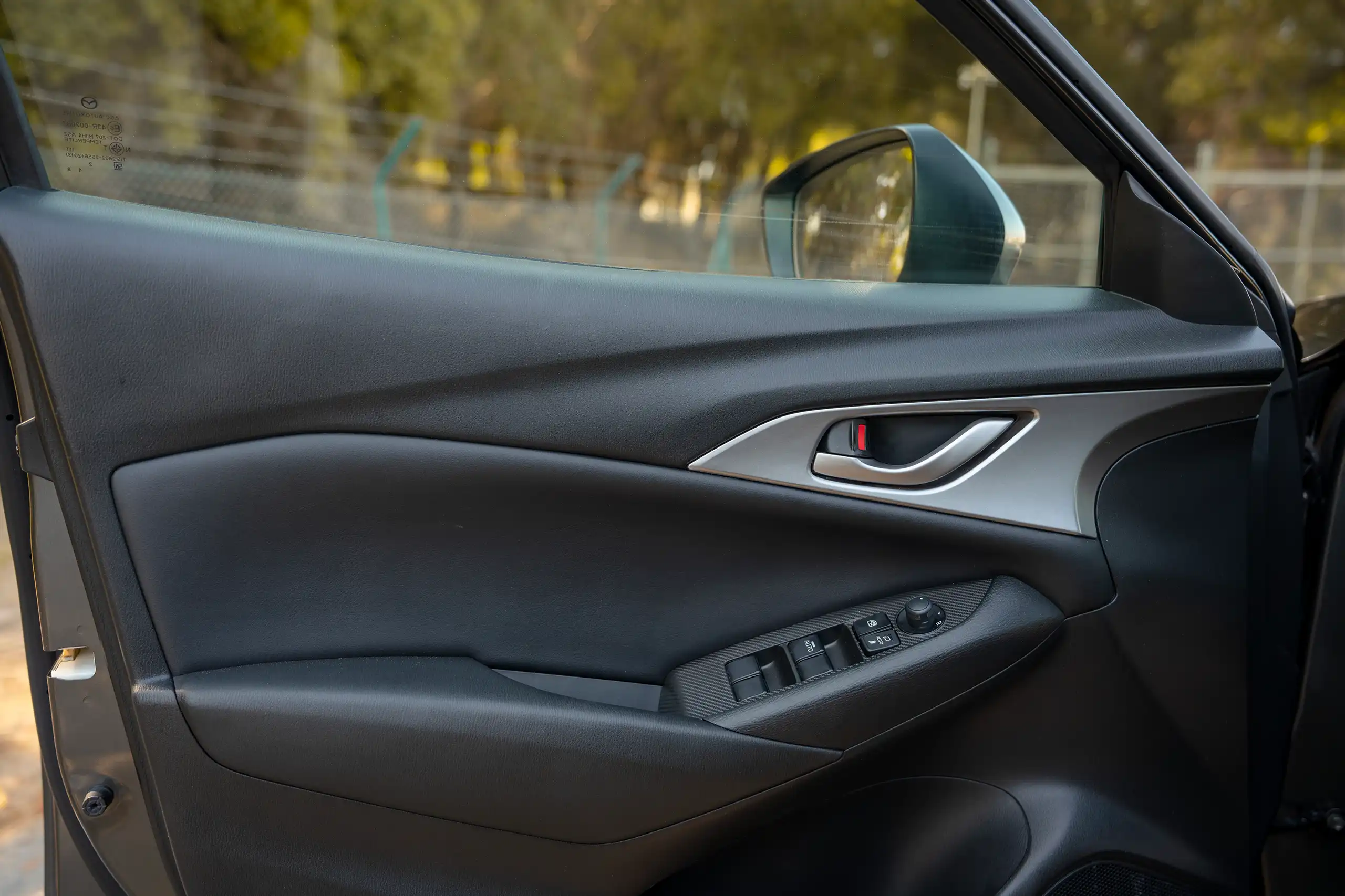 Used 2023 Mazda CX-3 GS Grey – Driver Door Panel Full View at First Choice Cars Sharjah