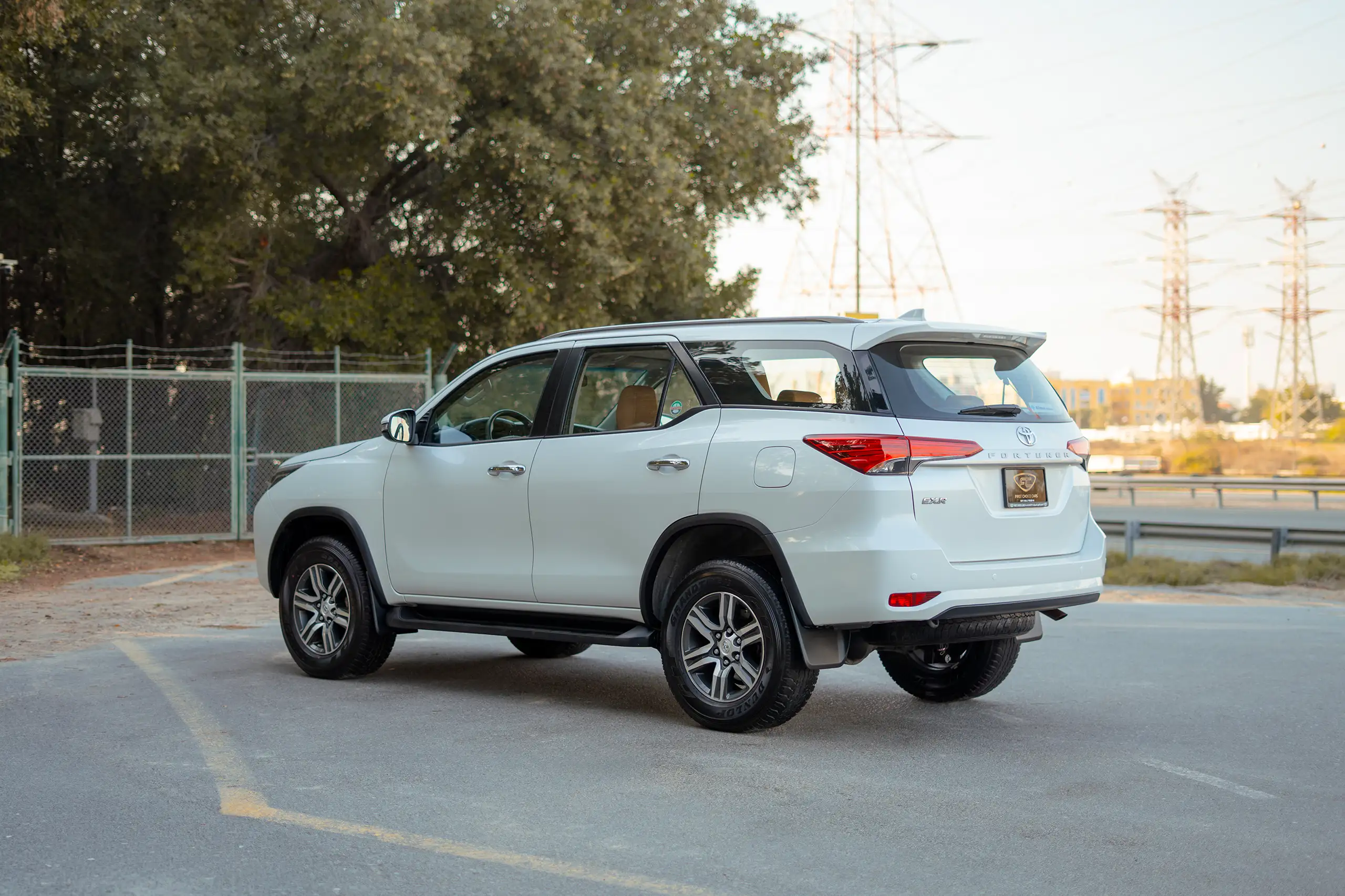 Used 2024 Toyota Fortuner EXR White – Left Back Diagonal (45°) View at First Choice Cars Sharjah