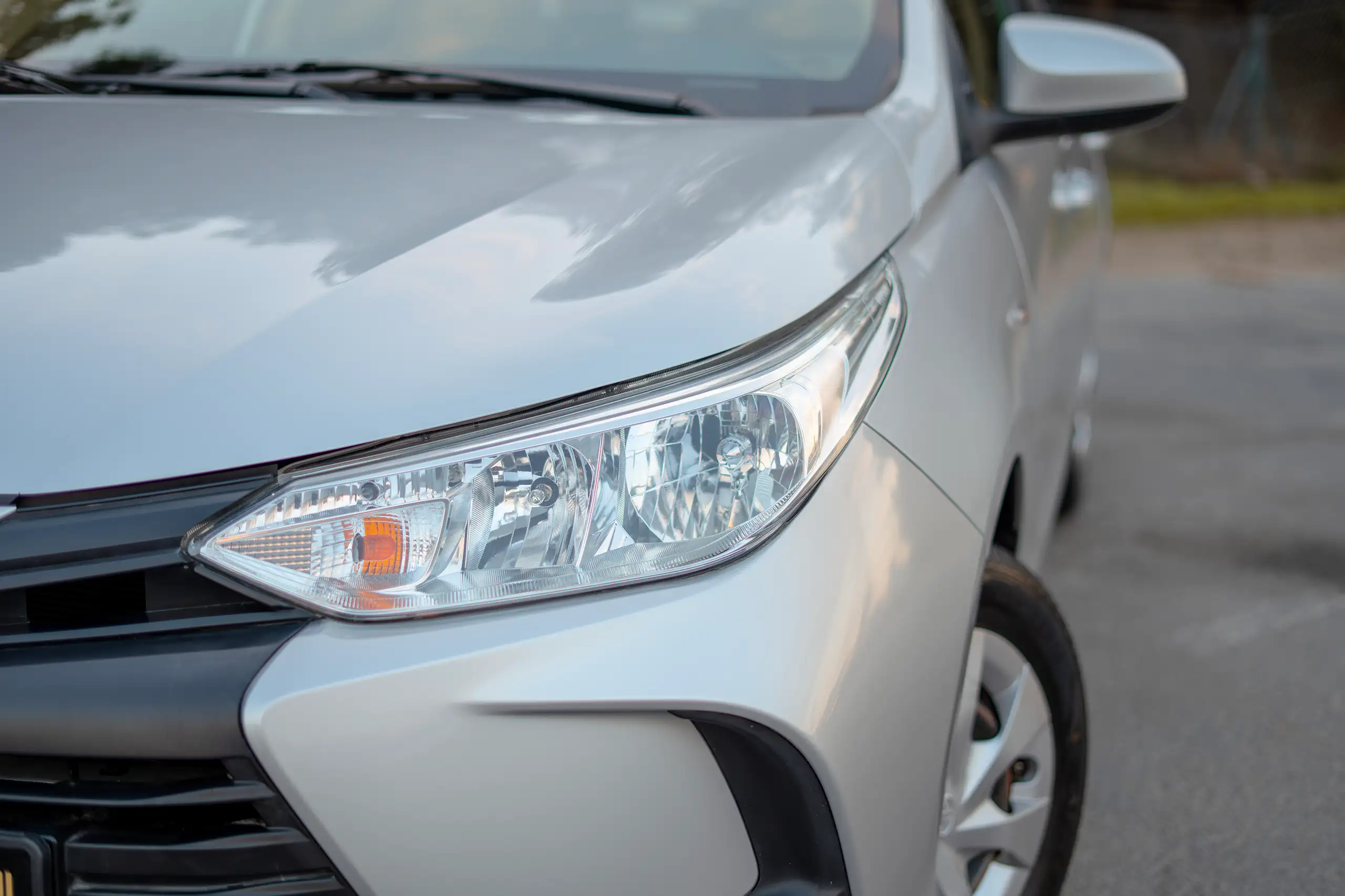 Used 2022 Toyota Yaris E Silver – Headlight Close-up at First Choice Cars Sharjah