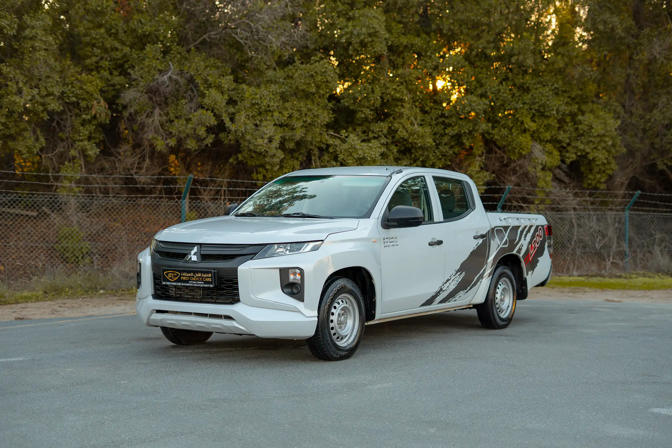 Used 2020 Mitsubishi L200 GL Double Cabin White – Left Front Diagonal (45°) View at First Choice Cars Sharjah