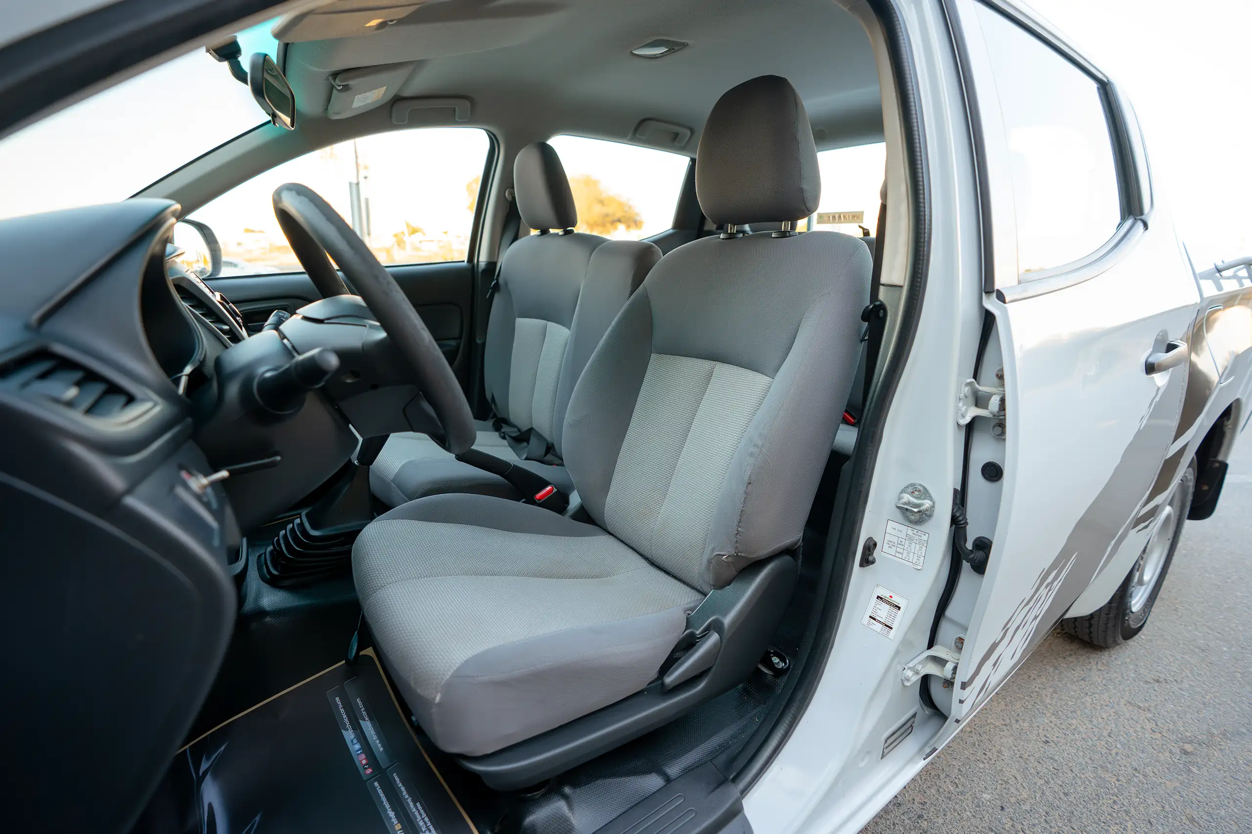 Used 2020 Mitsubishi L200 GL Double Cabin White – Front Driver Side Cabin View at First Choice Cars Sharjah