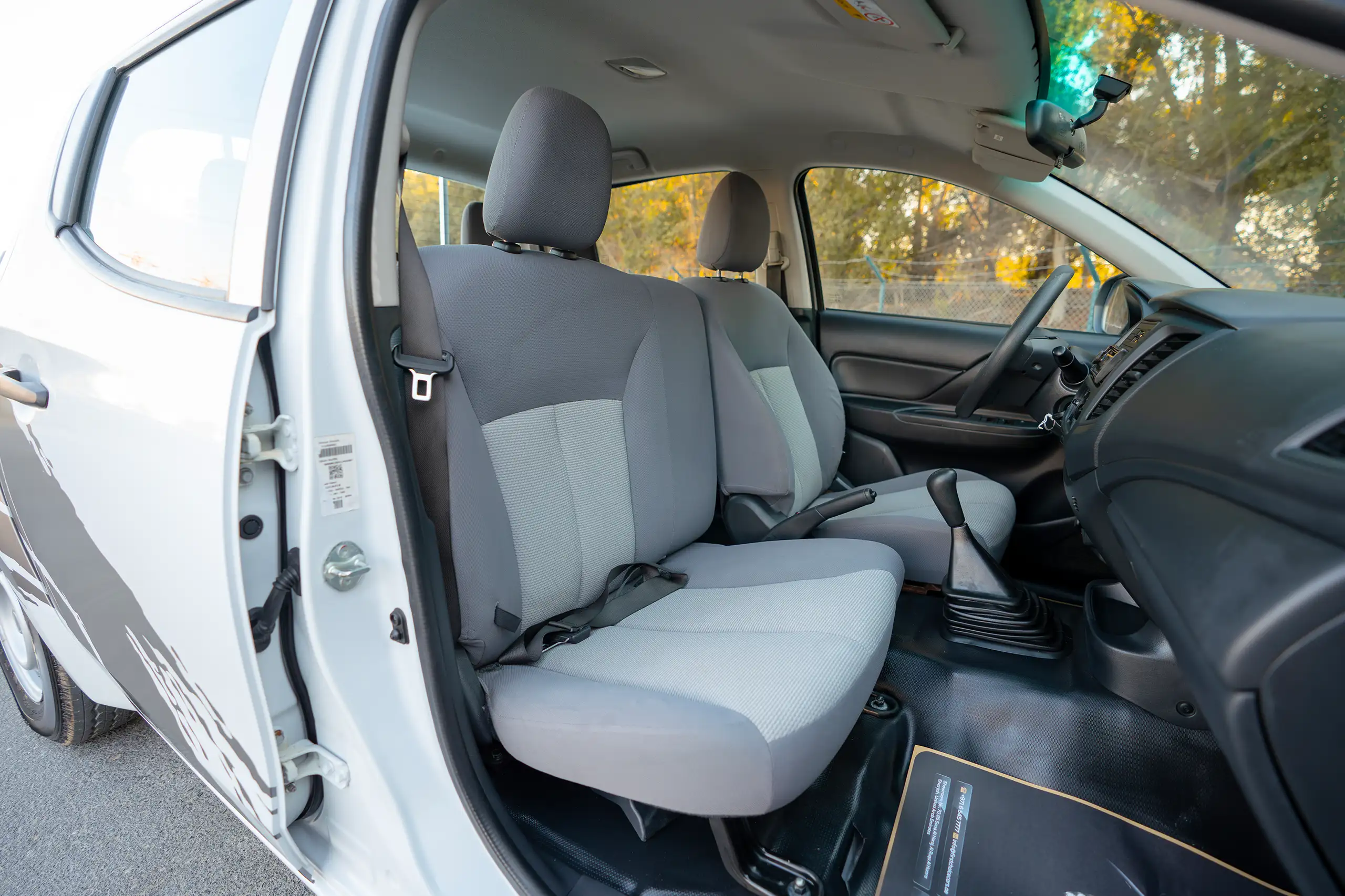 Used 2020 Mitsubishi L200 GL Double Cabin White – Front Passenger Side Cabin View at First Choice Cars Sharjah