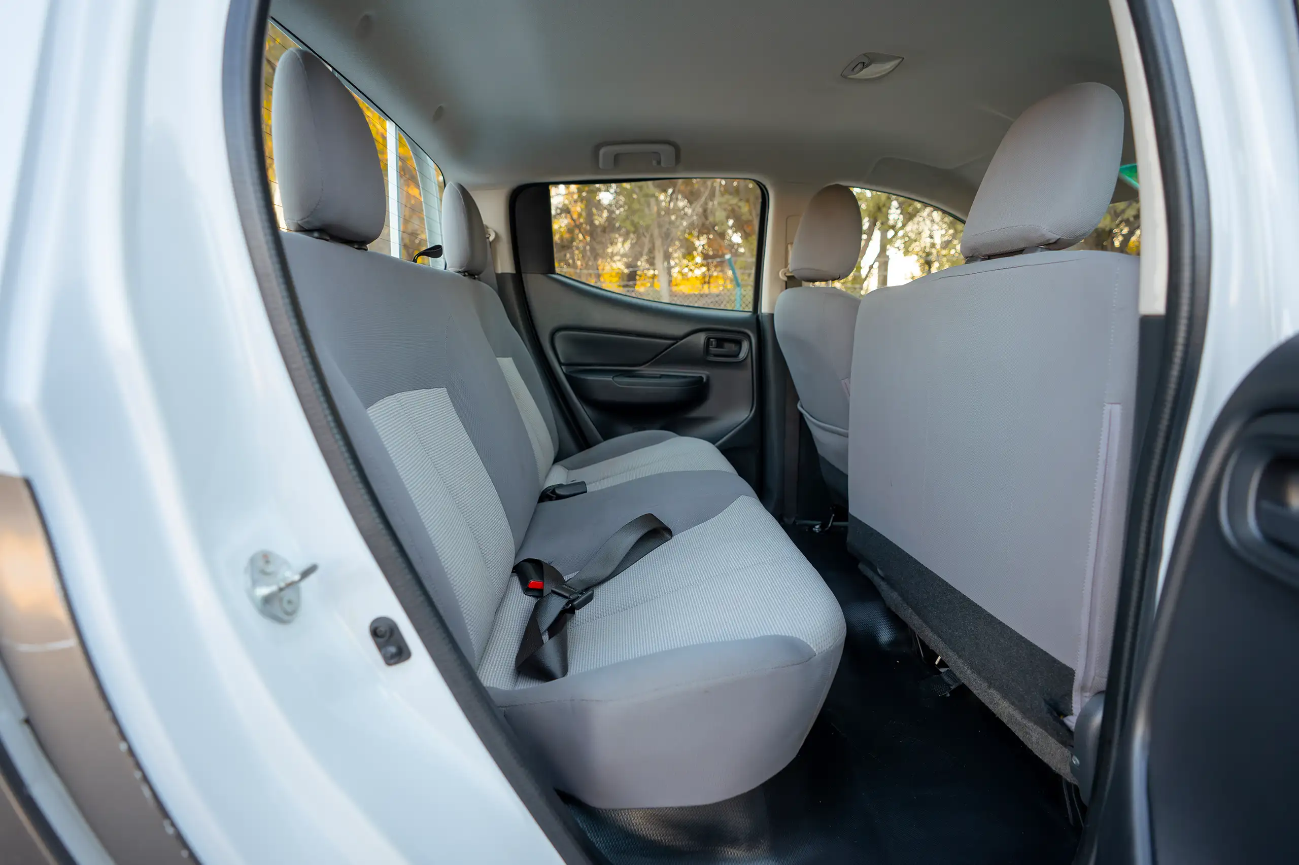 Used 2020 Mitsubishi L200 GL Double Cabin White – Rear Passenger Side Cabin View at First Choice Cars Sharjah