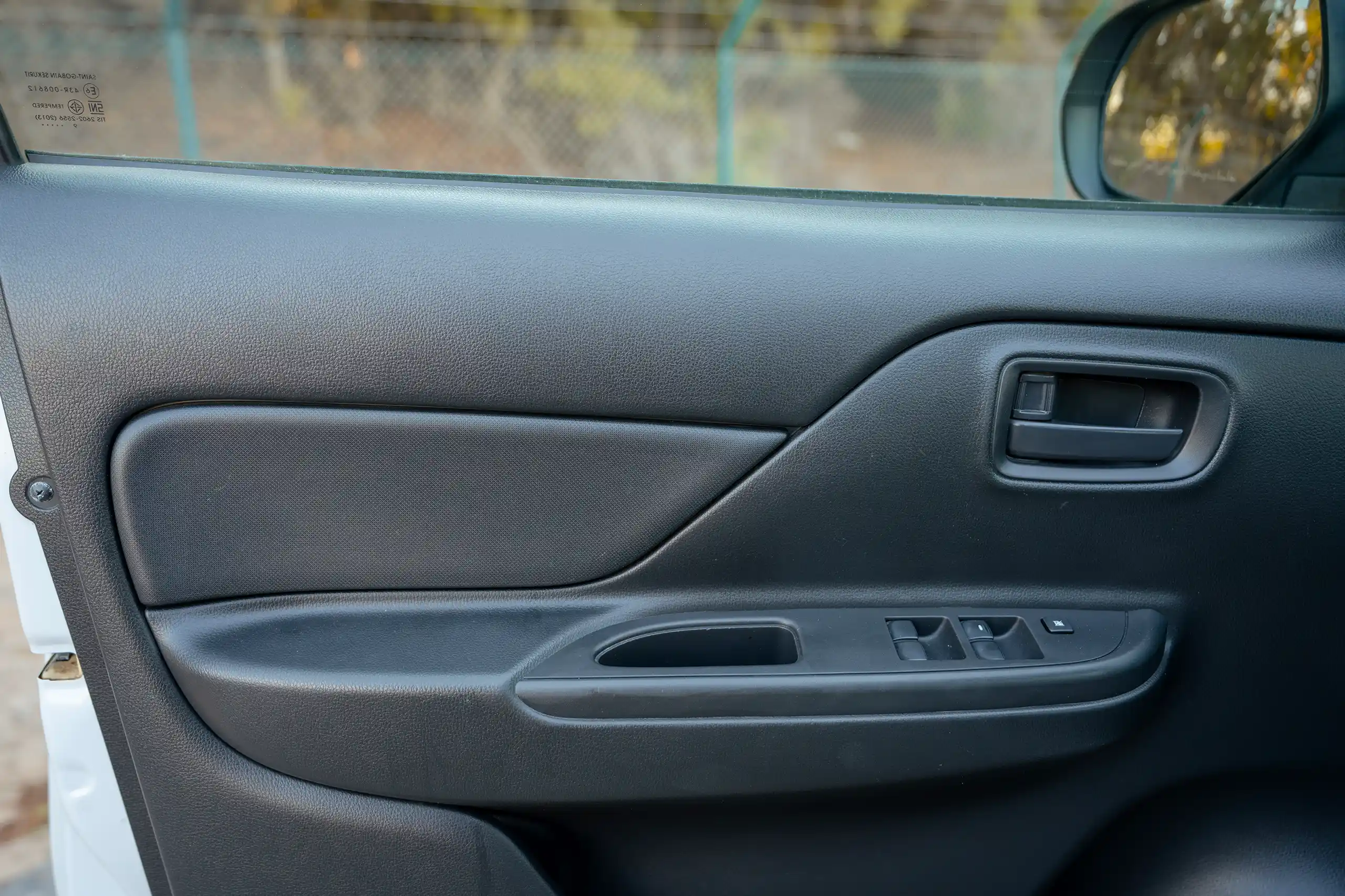 Used 2020 Mitsubishi L200 GL Double Cabin White – Driver Door Panel Full View at First Choice Cars Sharjah