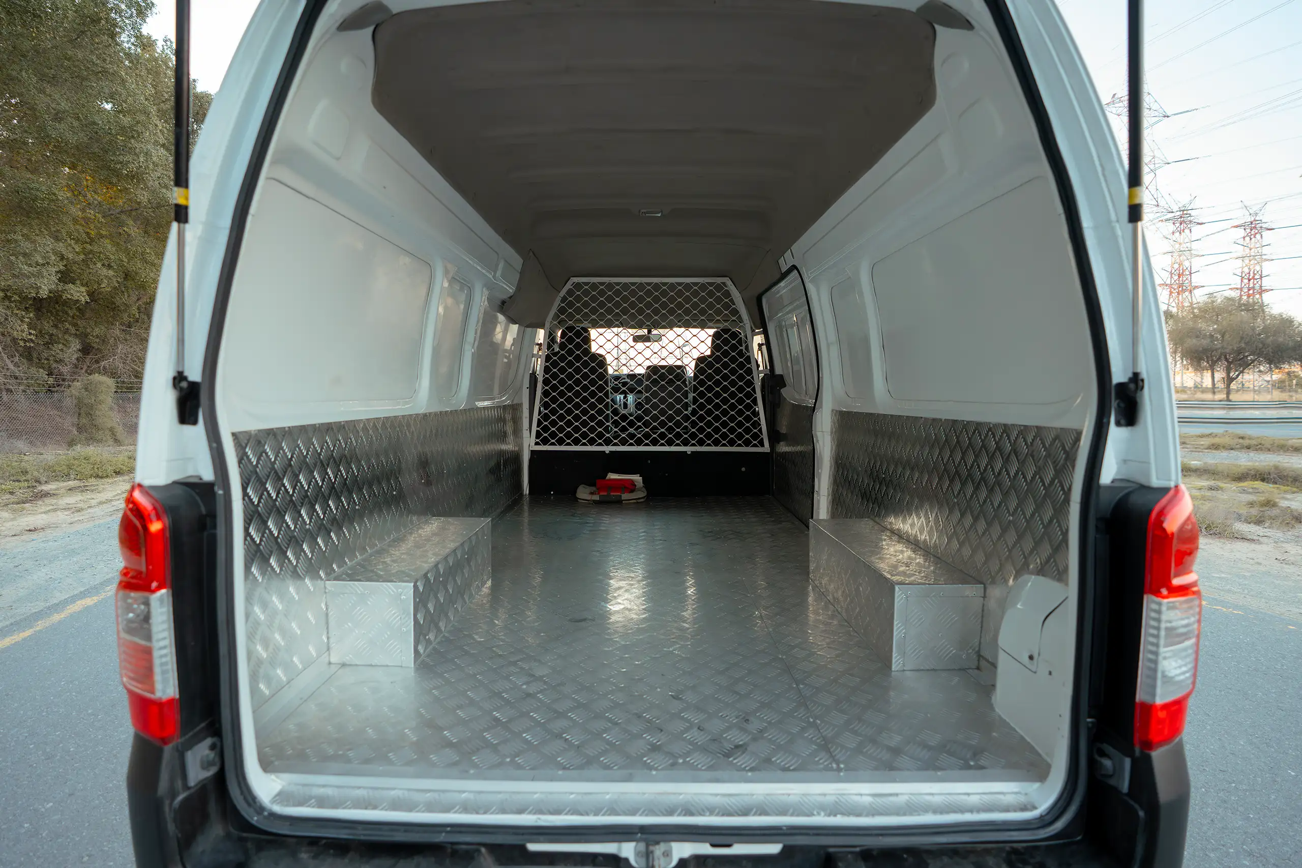 Used 2022 Nissan Urvan High Roof White – Delivery Box Rear Opening View at First Choice Cars Sharjah