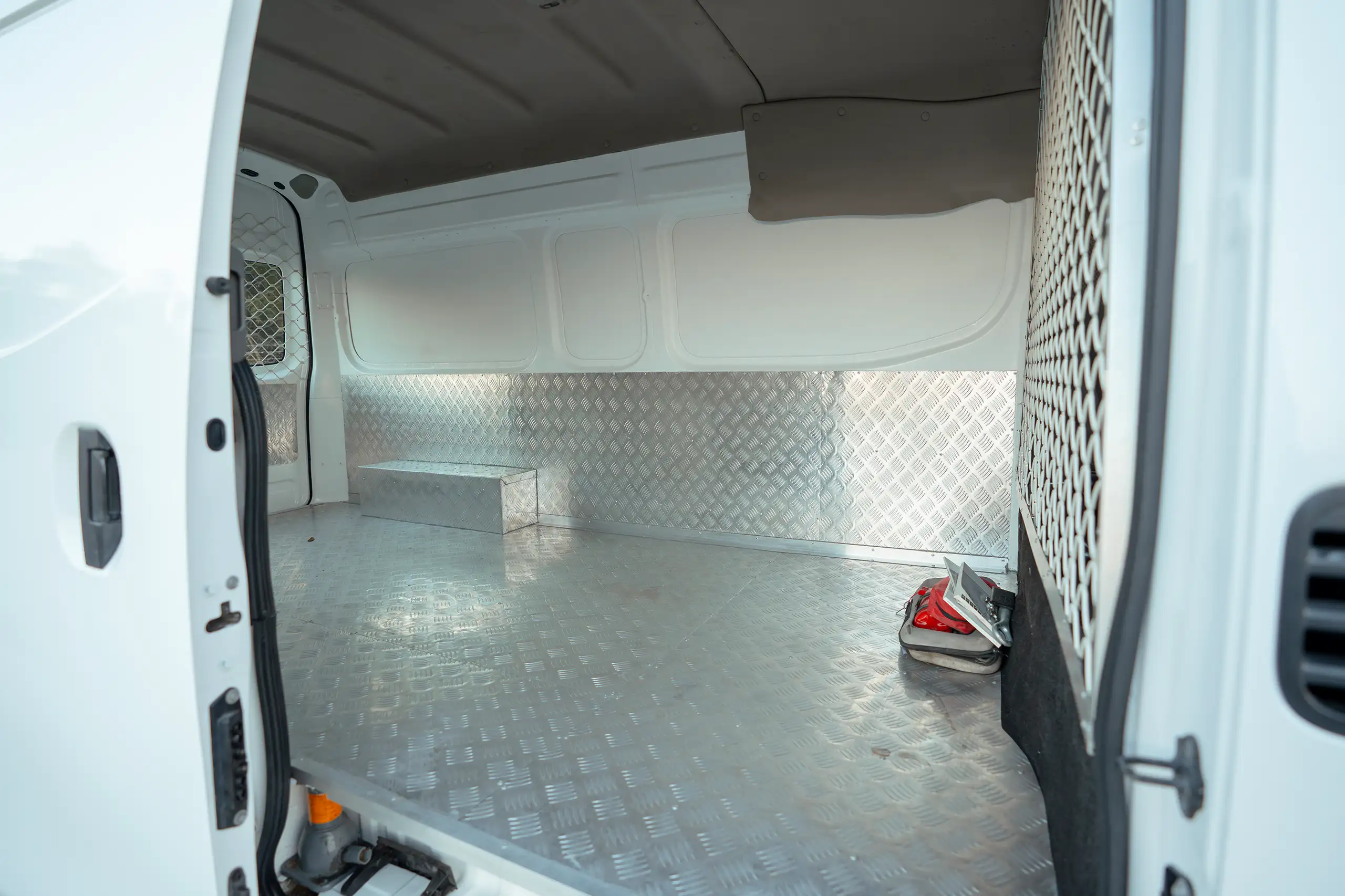 Used 2022 Nissan Urvan High Roof White – Delivery Box Right Side Interior View at First Choice Cars Sharjah