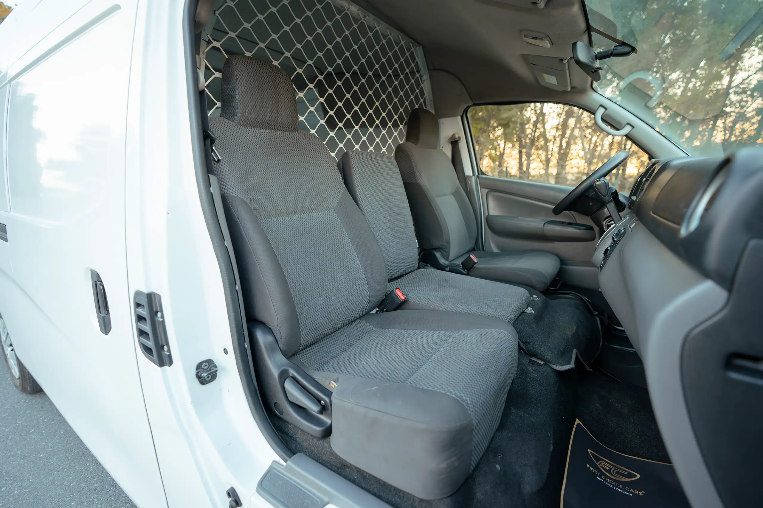 Used 2022 Nissan Urvan High Roof White – Front Passenger Side Cabin View at First Choice Cars Sharjah