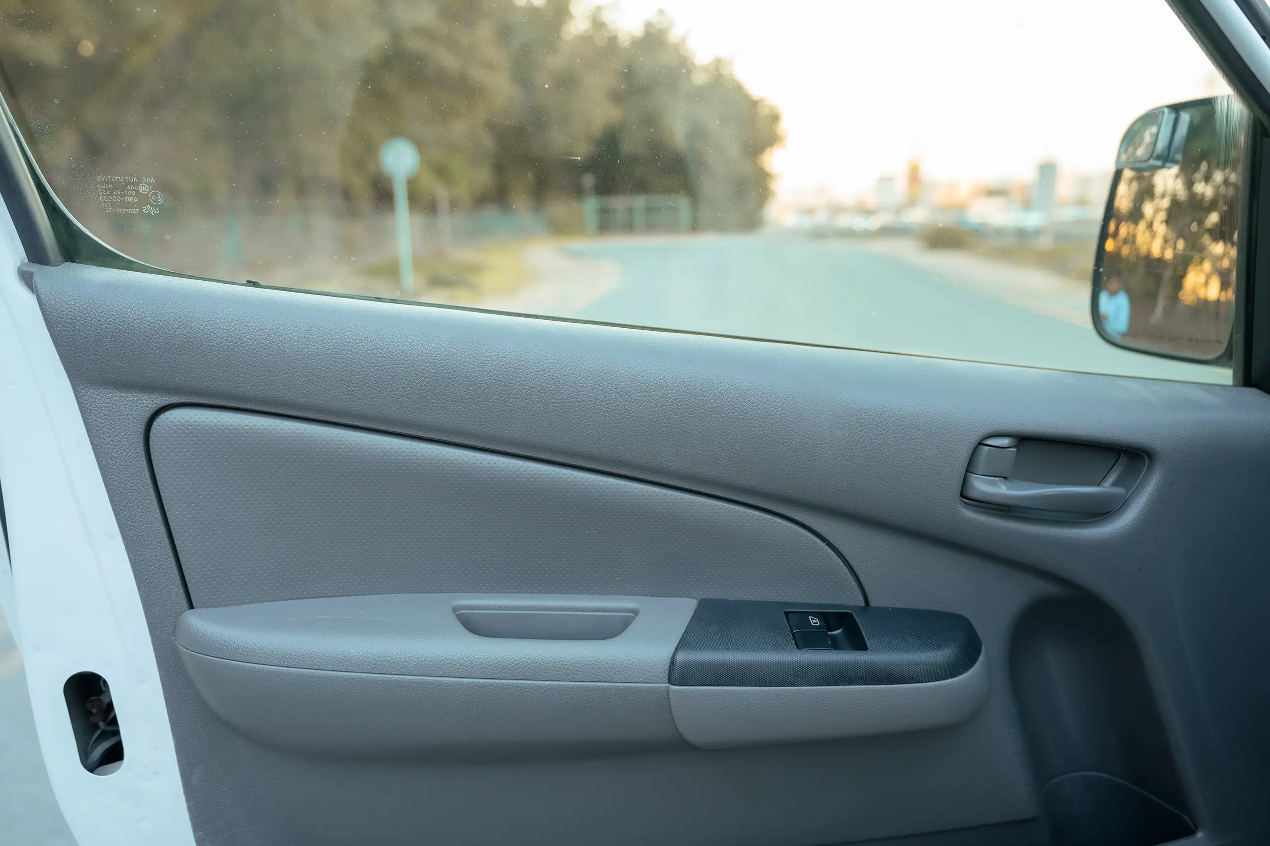 Used 2022 Nissan Urvan High Roof White – Driver Door Panel Full View at First Choice Cars Sharjah