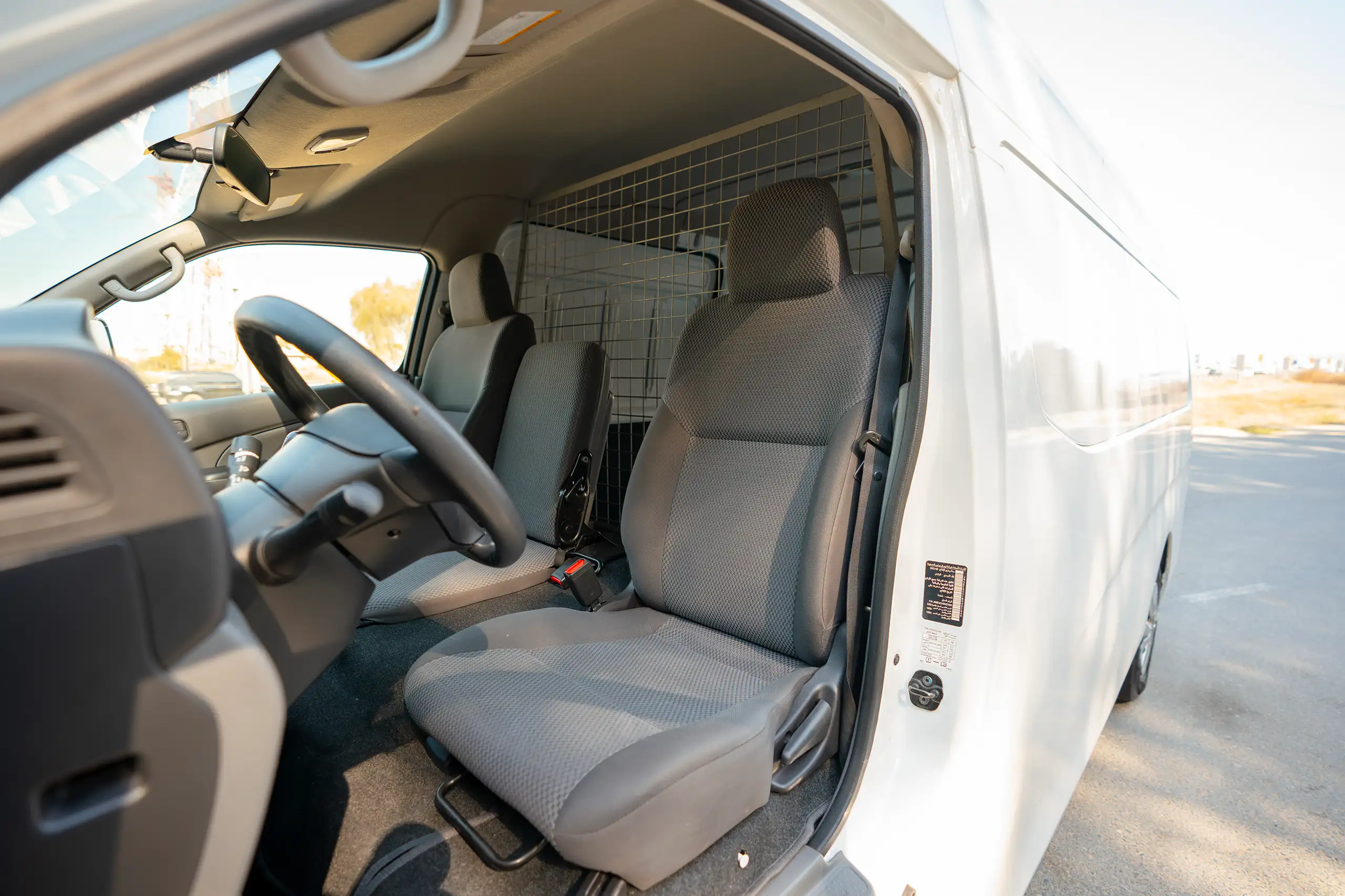 Used 2022 Nissan Urvan High Roof White – Front Driver Side Cabin View at First Choice Cars Sharjah