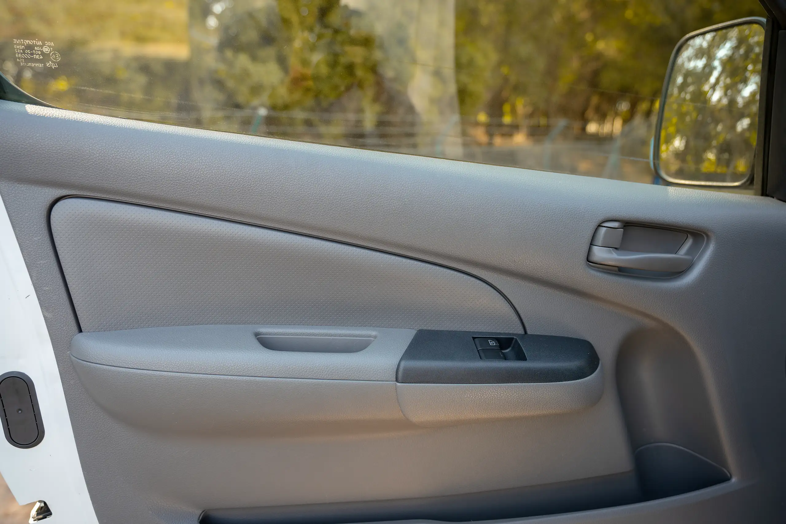 Used 2022 Nissan Urvan High Roof White – Driver Door Panel Full View at First Choice Cars Sharjah