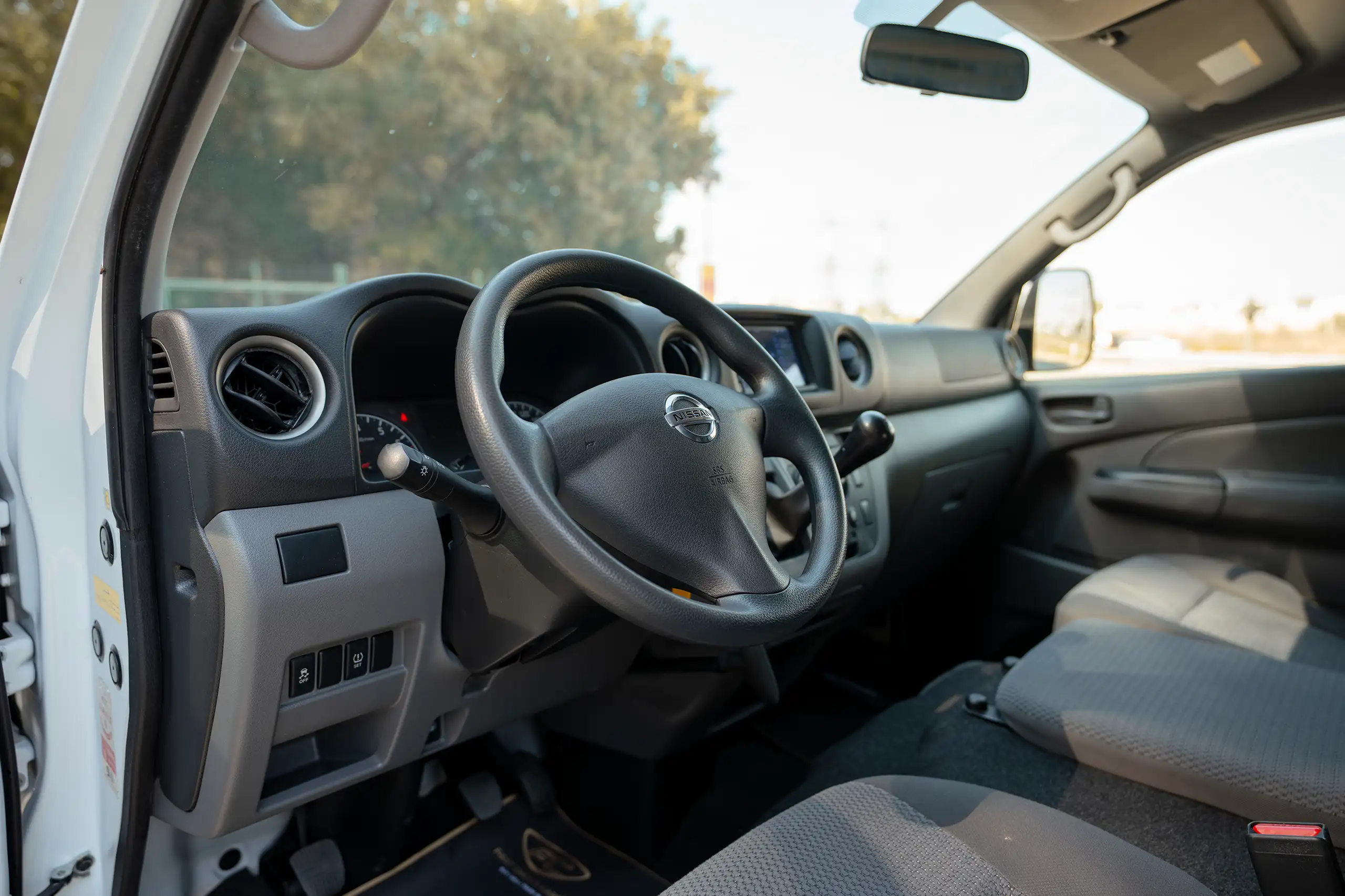 Used 2022 Nissan Urvan High Roof White – Driver Side Dashboard & Steering View at First Choice Cars Sharjah