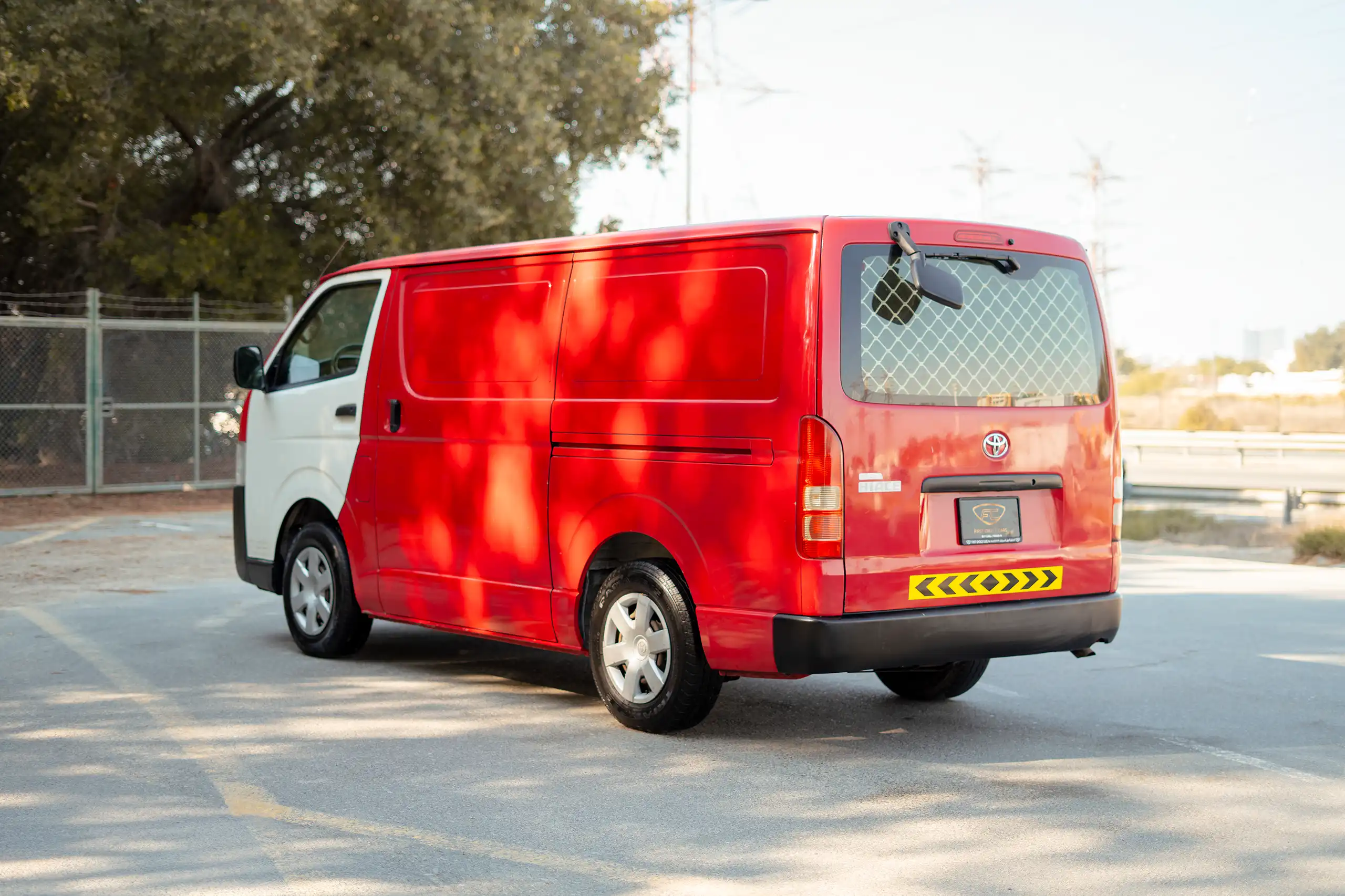 Used 2020 Toyota Hiace GL High Roof Red – Left Back Diagonal (45°) View at First Choice Cars Sharjah