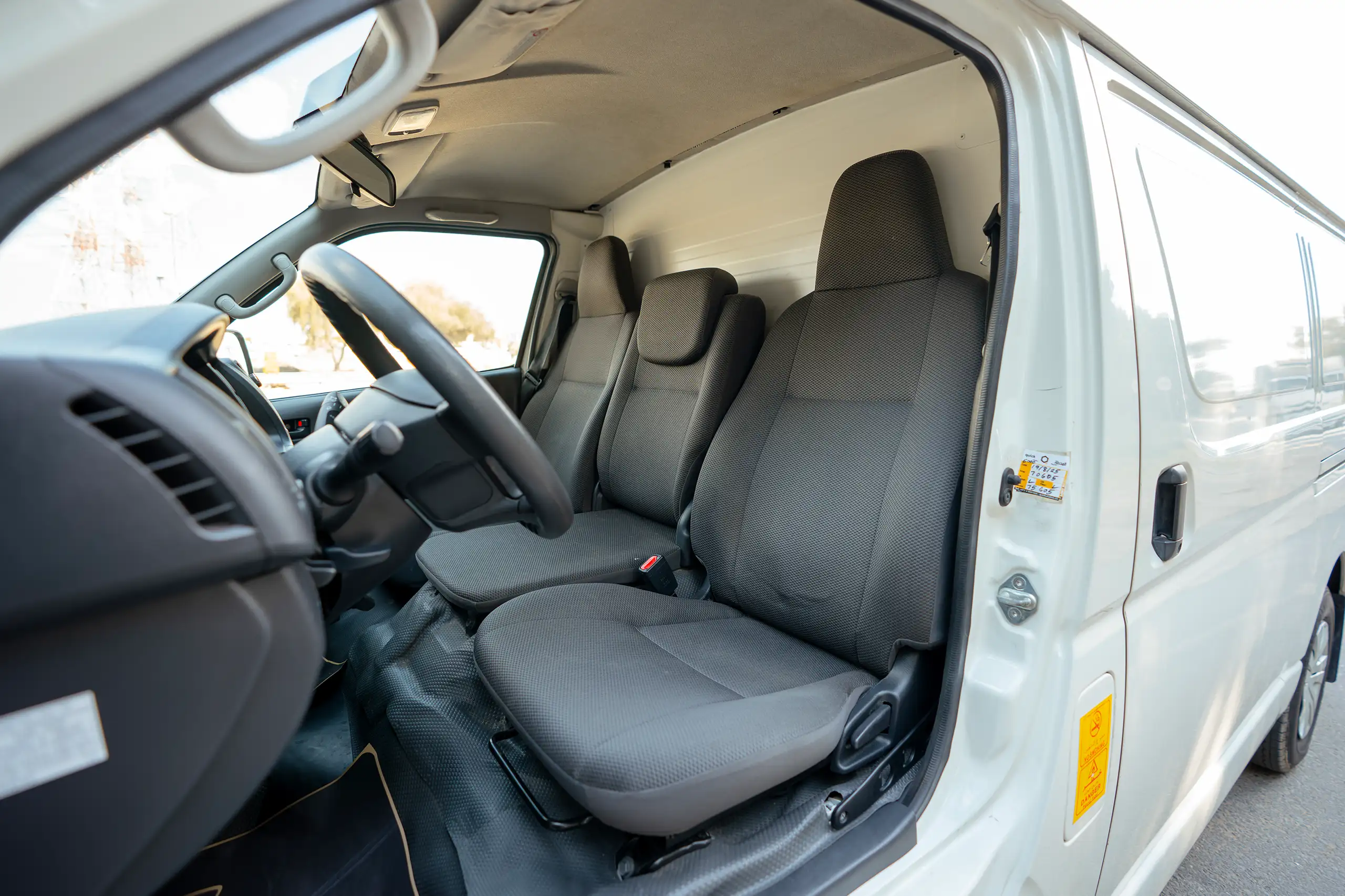 Used 2023 Toyota Hiace GL Standard Roof White – Front Driver Side Cabin View at First Choice Cars Sharjah