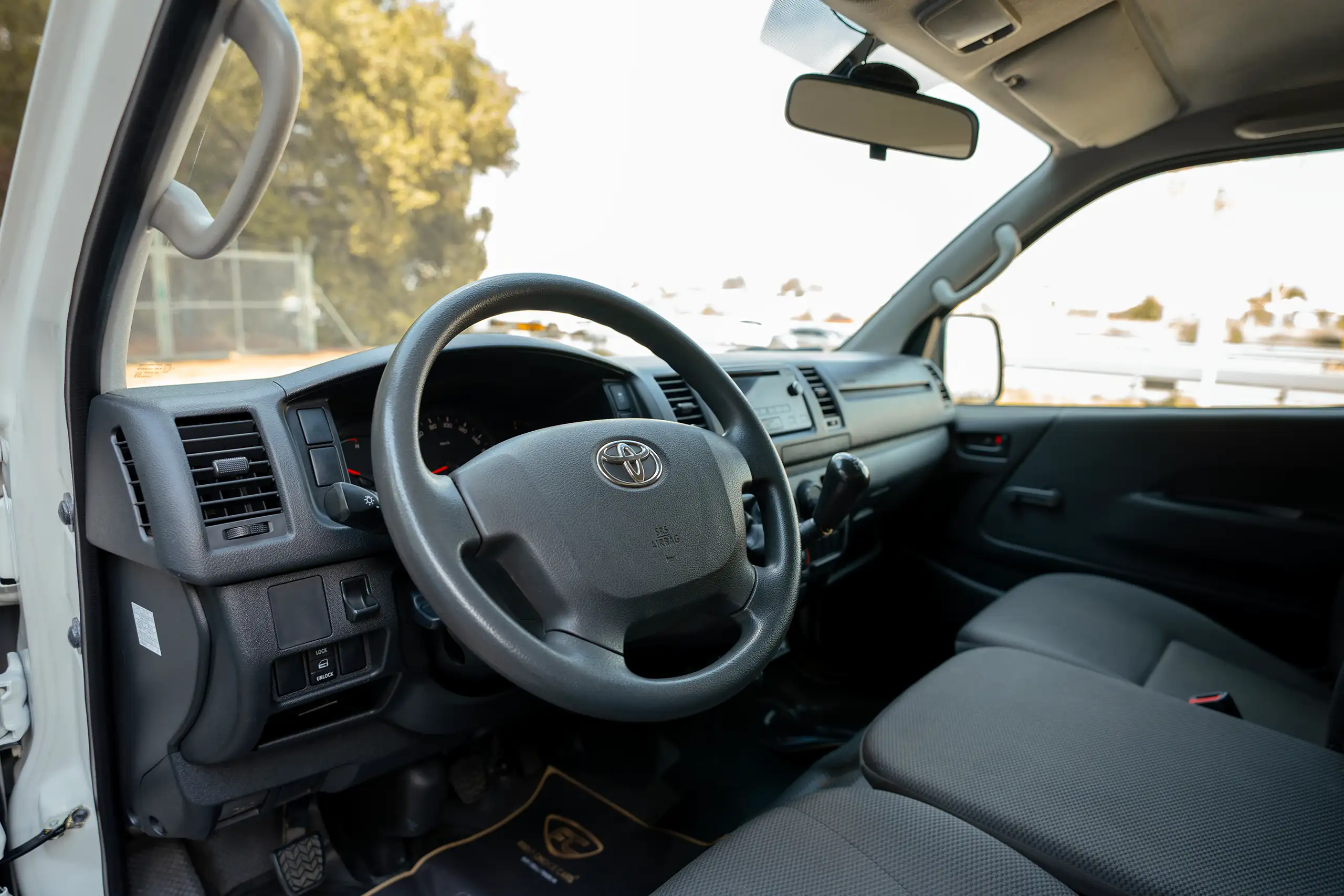 Used 2023 Toyota Hiace GL Standard Roof White – Driver Side Dashboard & Steering View at First Choice Cars Sharjah