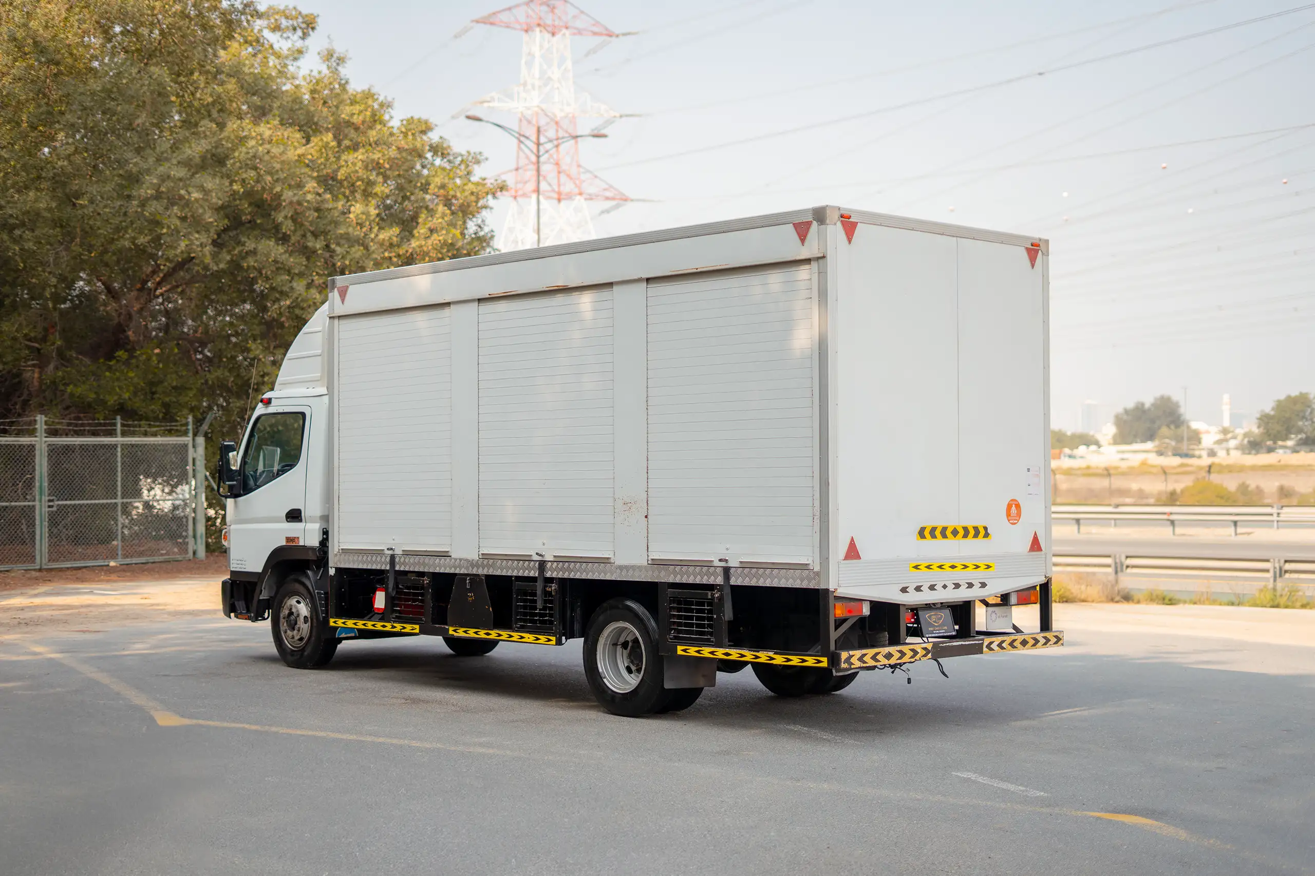 Used 2020 Mitsubishi Canter Chiller Box White – Left Back Diagonal (45°) View at First Choice Cars Sharjah