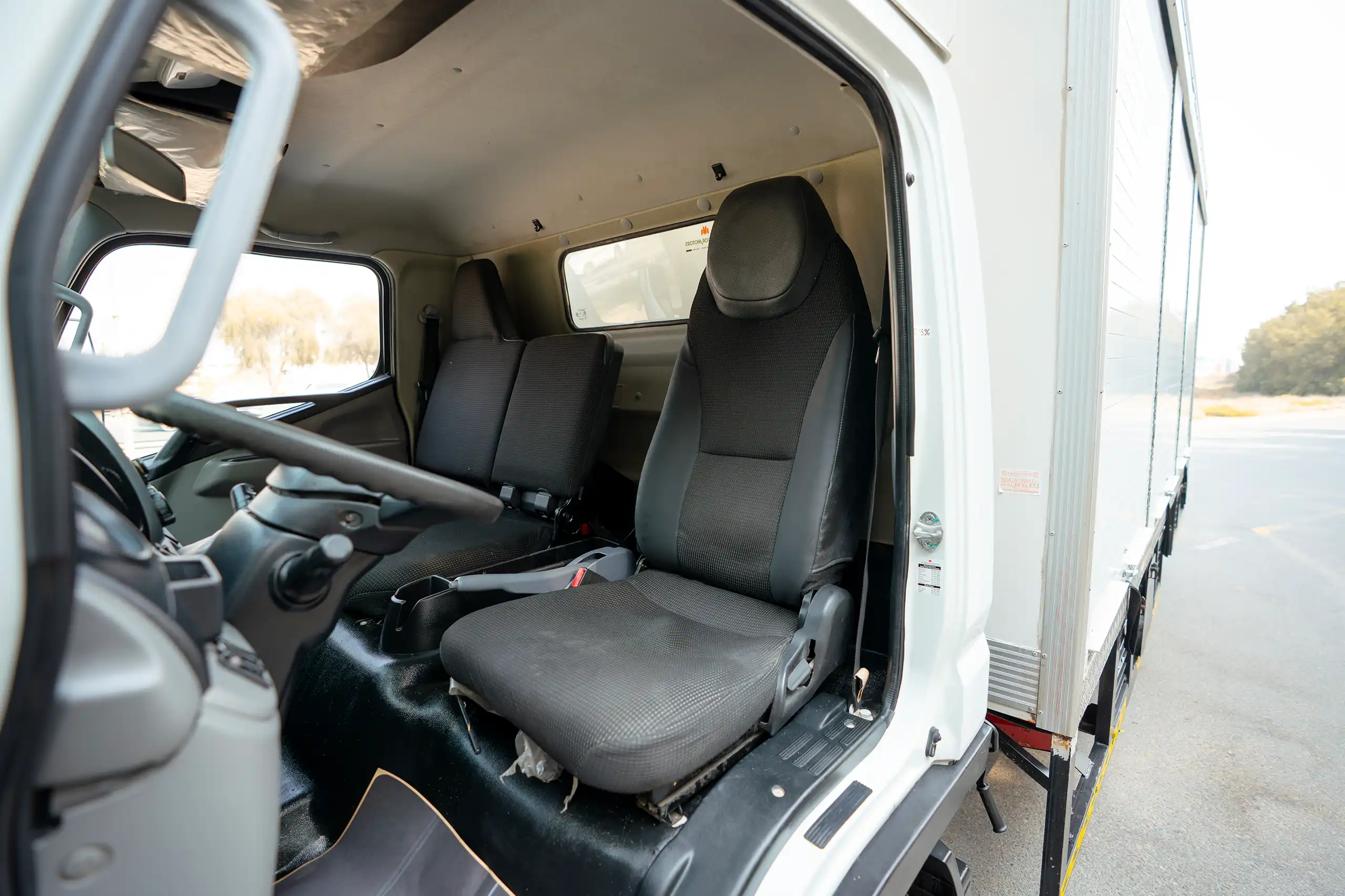 Used 2020 Mitsubishi Canter Chiller Box White – Front Driver Side Cabin View at First Choice Cars Sharjah