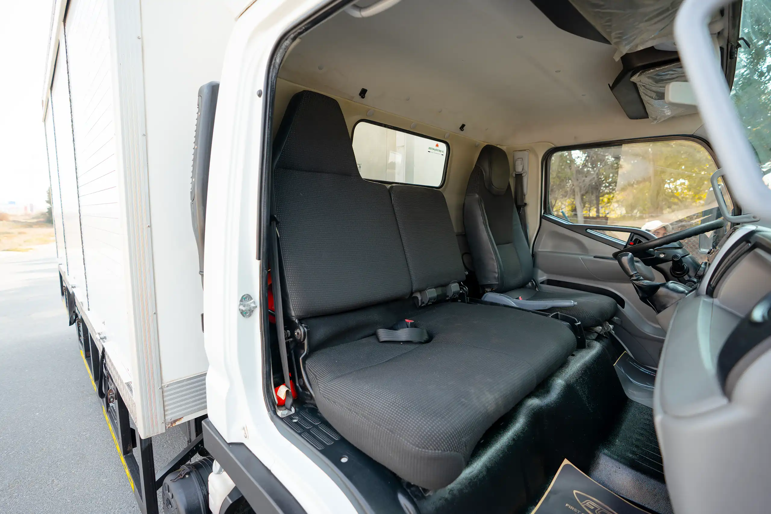 Used 2020 Mitsubishi Canter Chiller Box White – Front Passenger Side Cabin View at First Choice Cars Sharjah