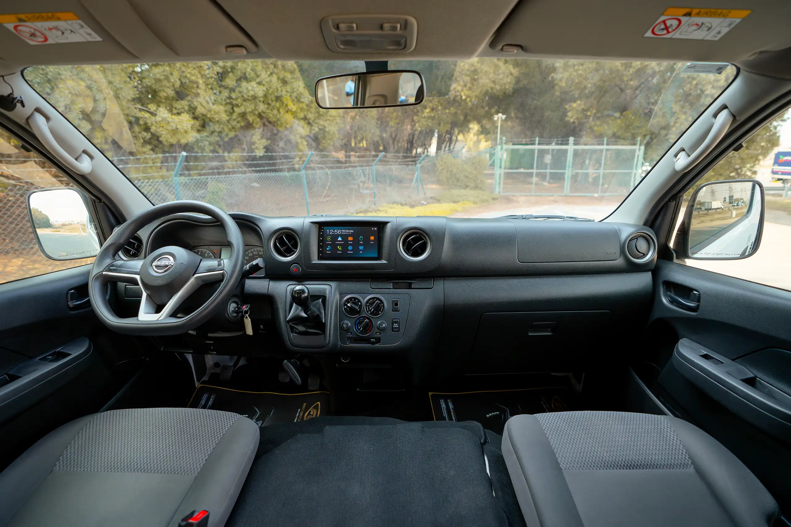 Used 2024 Nissan Urvan High Roof White – Front Cabin / Dashboard Full View at First Choice Cars Sharjah