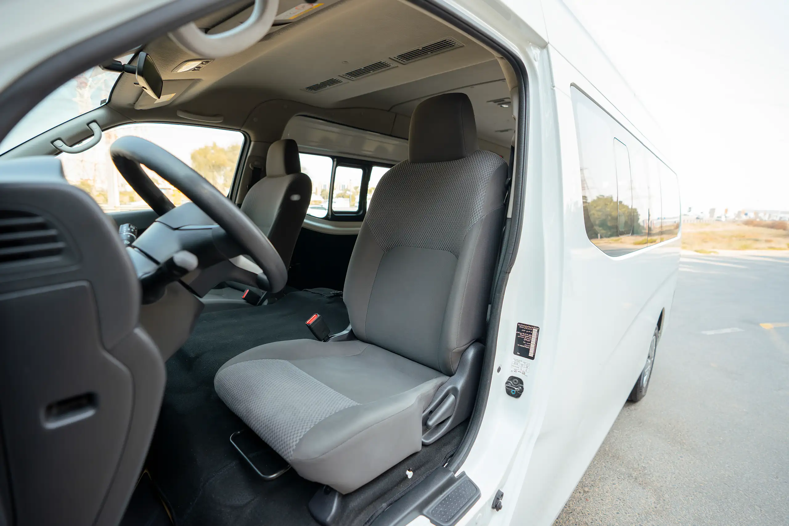 Used 2024 Nissan Urvan High Roof White – Front Driver Side Cabin View at First Choice Cars Sharjah