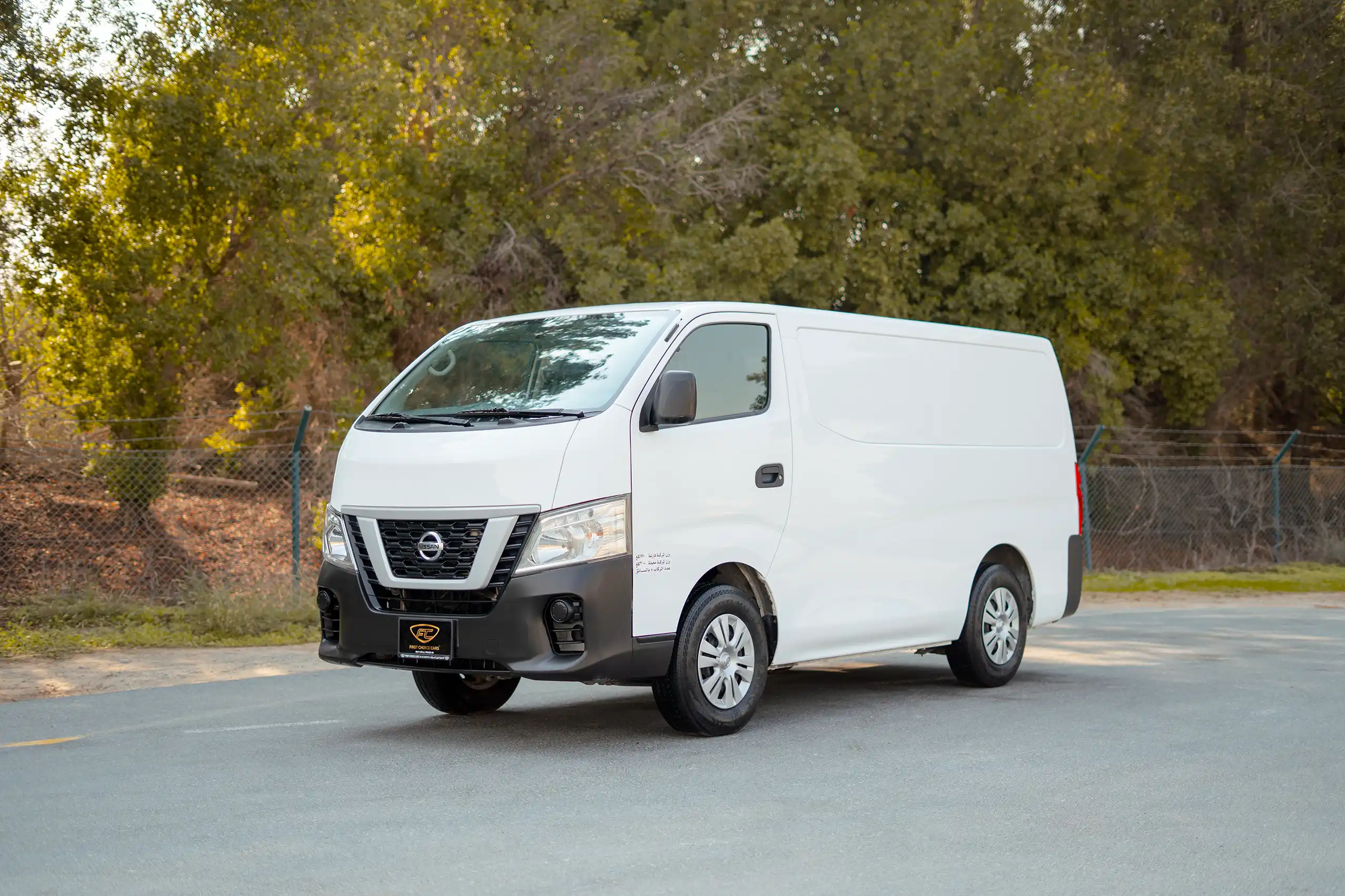 Used 2022 Nissan Urvan Standard Roof White – Left Front Diagonal (45°) View at First Choice Cars Sharjah