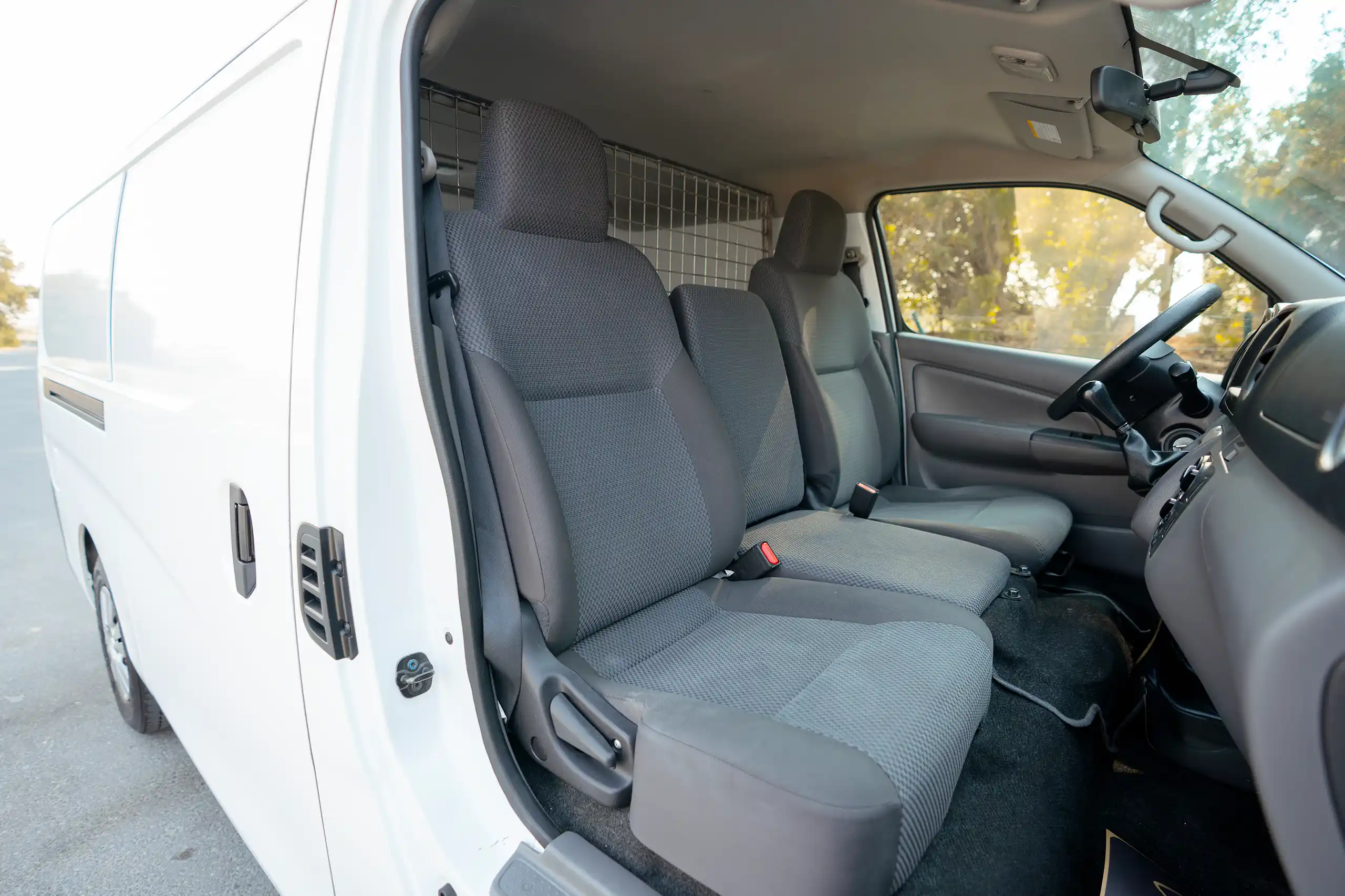 Used 2022 Nissan Urvan Standard Roof White – Front Passenger Side Cabin View at First Choice Cars Sharjah