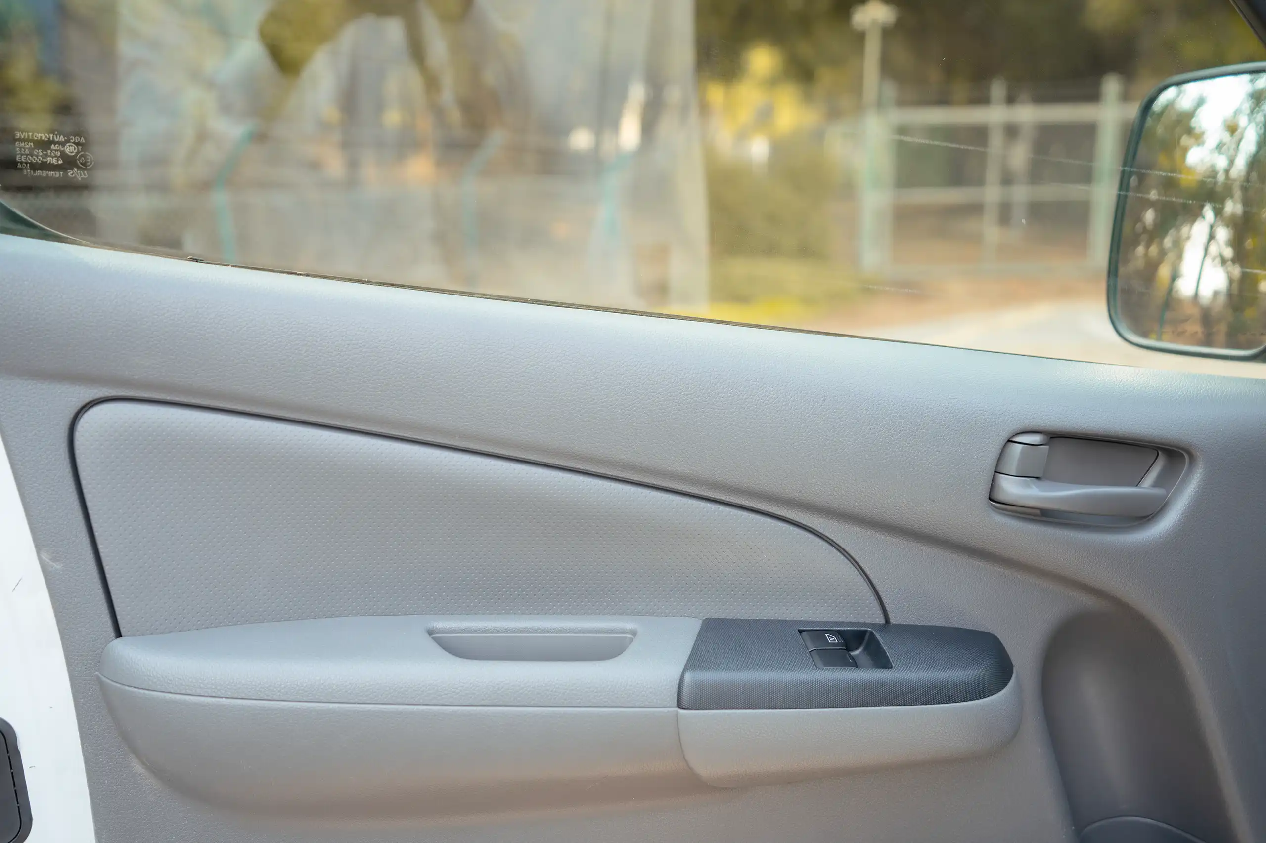 Used 2022 Nissan Urvan Standard Roof White – Driver Door Panel Full View at First Choice Cars Sharjah