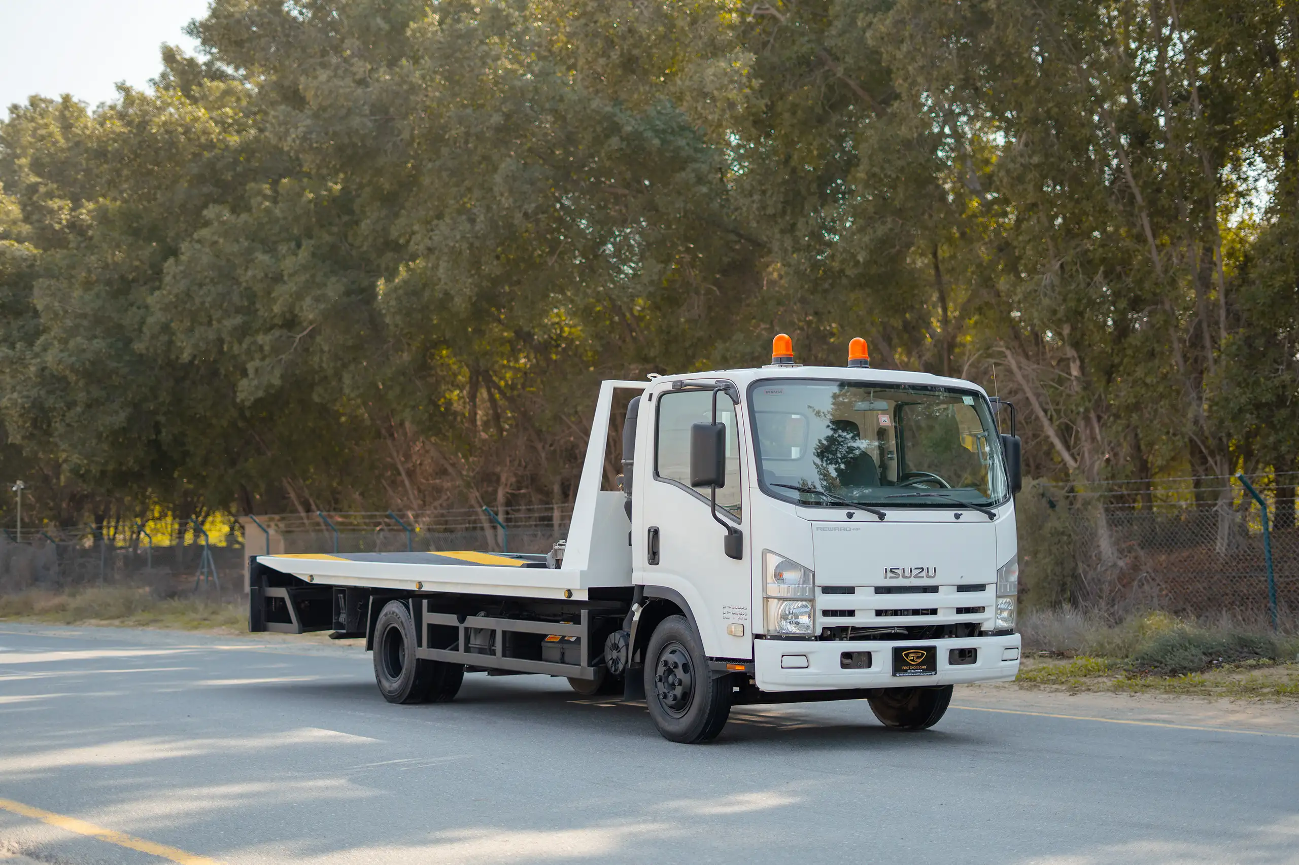 Used 2017 Isuzu NPR Recovery in White – Right Front Diagonal (45°) View for Sale at First Choice Cars Dubai Sharjah