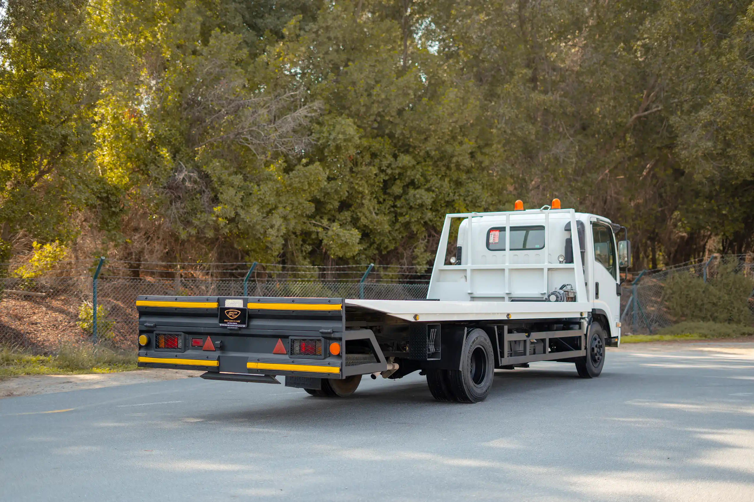 Used 2017 Isuzu NPR Recovery Truck White – Right Back Diagonal (45°) View at First Choice Cars Sharjah