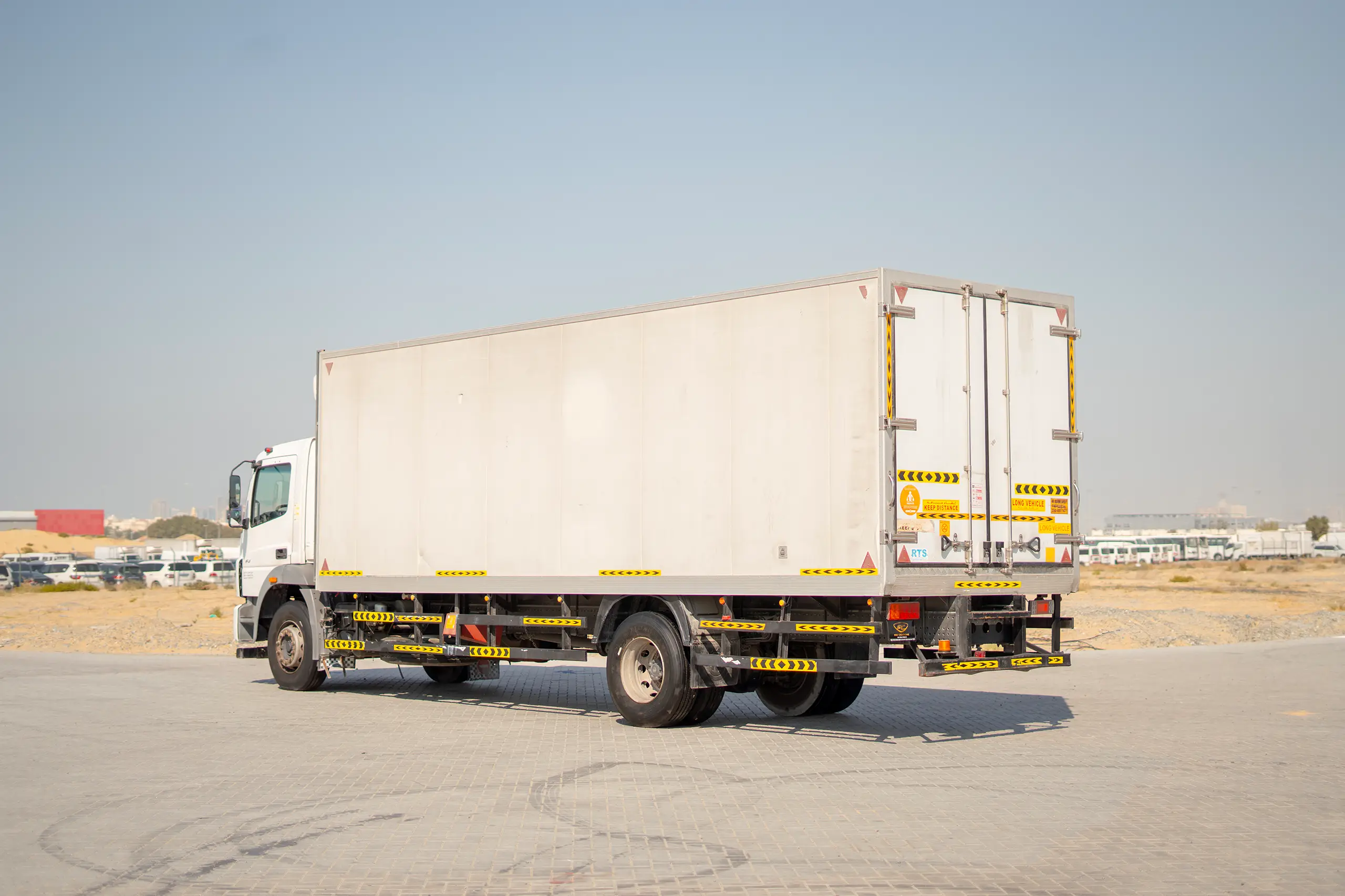 Used 2020 Mitsubishi FUSO FJ Freezer Box White – Left Back Diagonal (45°) View at First Choice Cars Sharjah