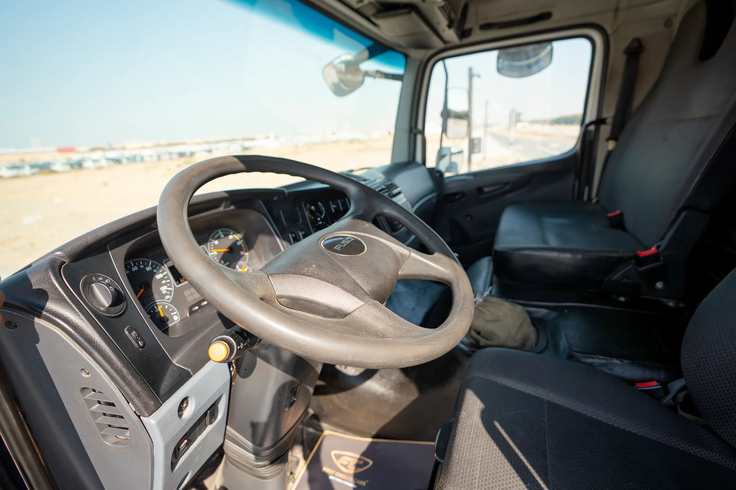 Used 2020 Mitsubishi FUSO FJ Freezer Box White – Driver Side Dashboard & Steering View at First Choice Cars Sharjah