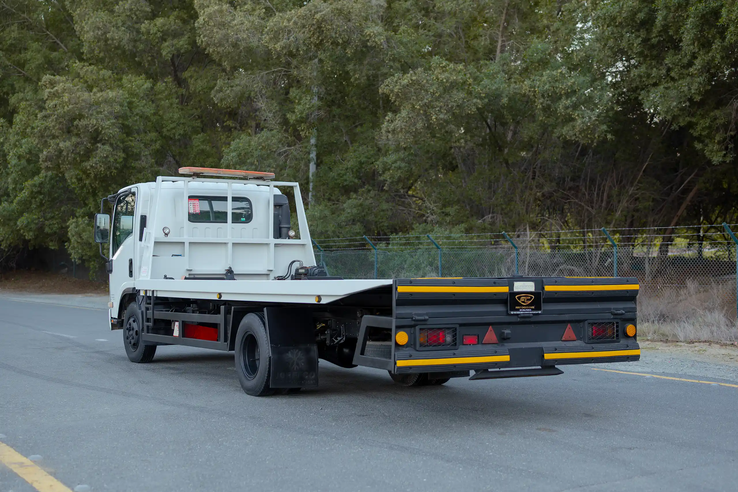 Used 2017 Isuzu NPR Recovery White – Left Back Diagonal (45°) View at First Choice Cars Sharjah