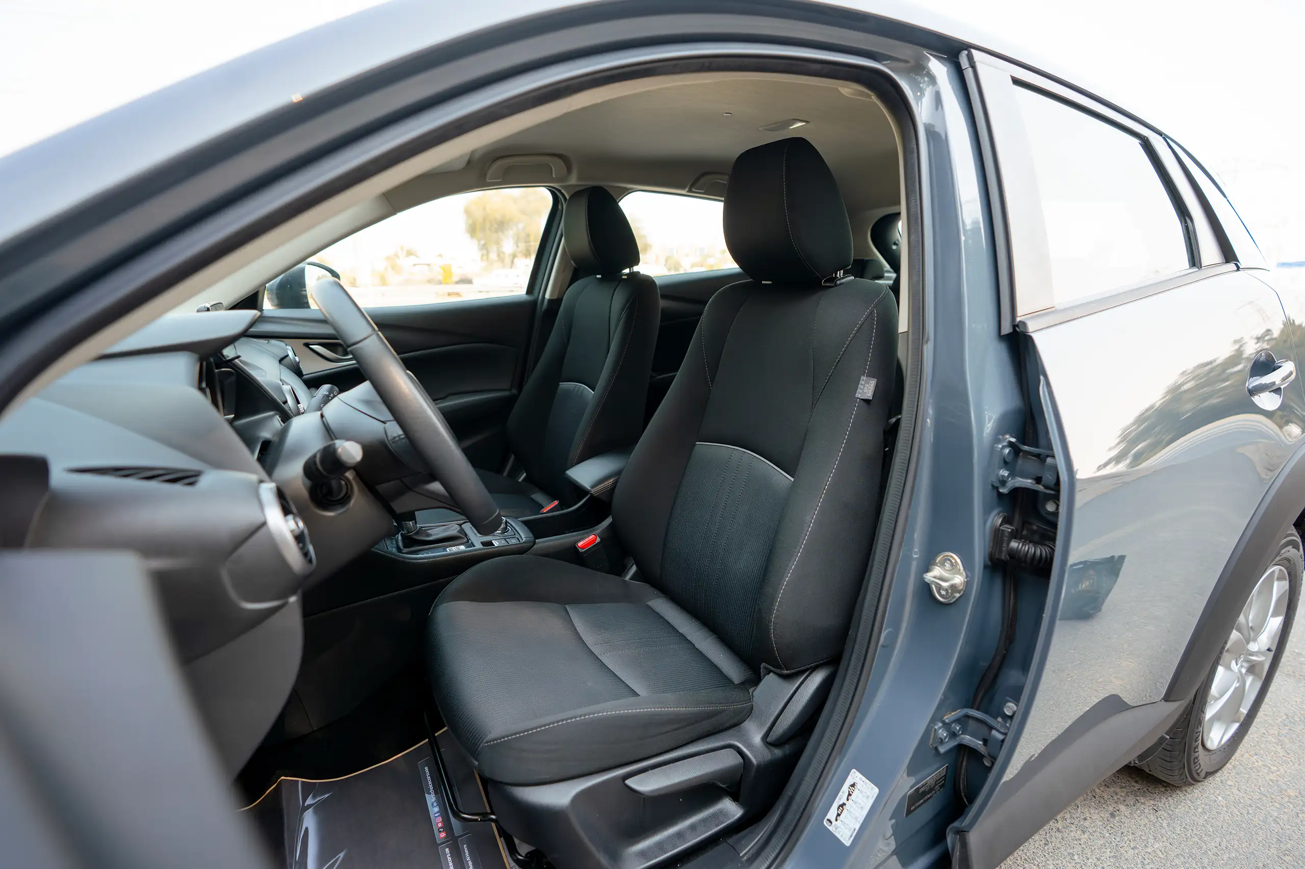 Used 2023 Mazda CX-3 GS Blue – Front Driver Side Cabin View at First Choice Cars Sharjah