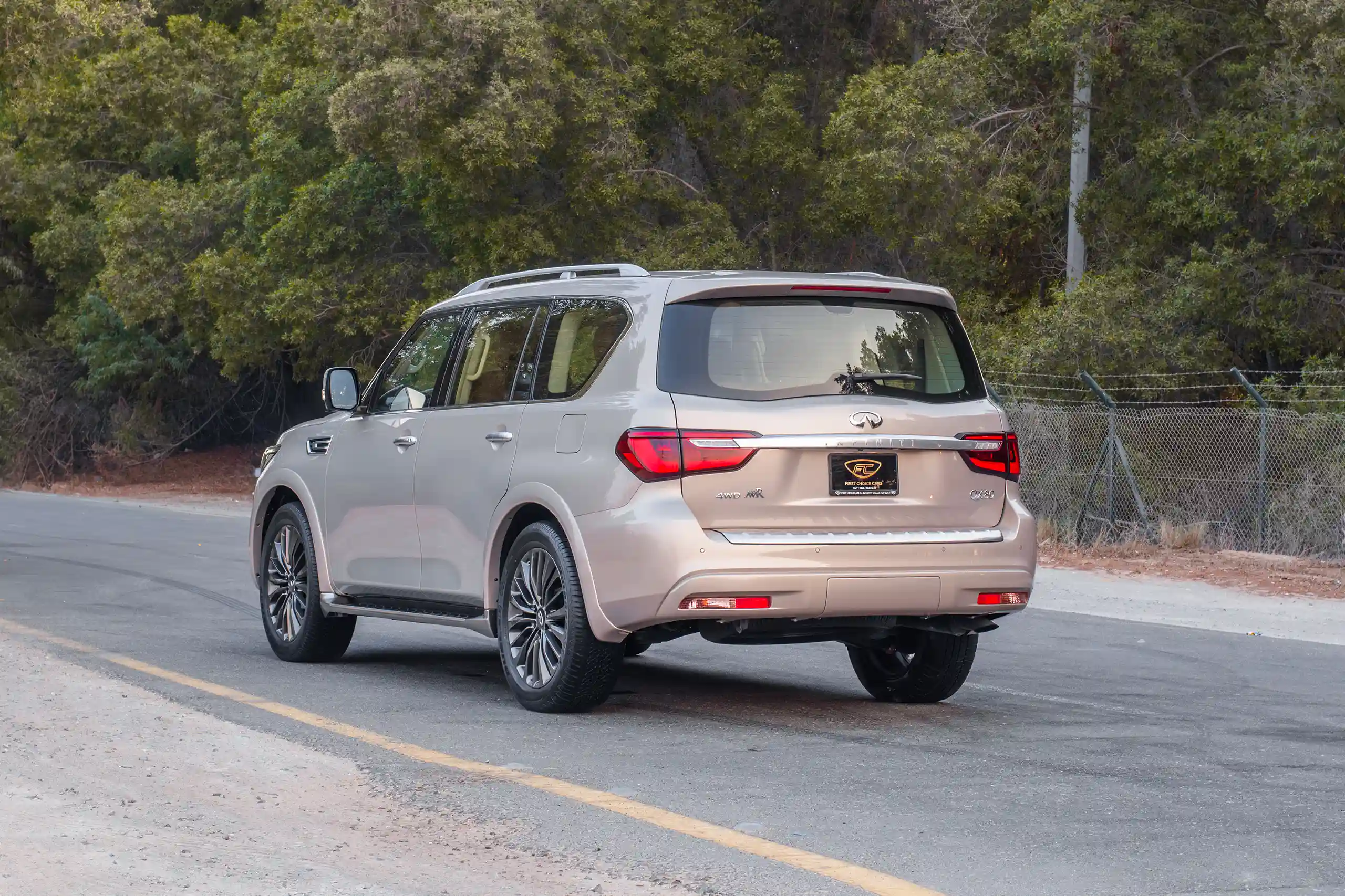Used 2023 Infiniti QX80 Luxury Gold – Left Back Diagonal (45°) View at First Choice Cars Sharjah