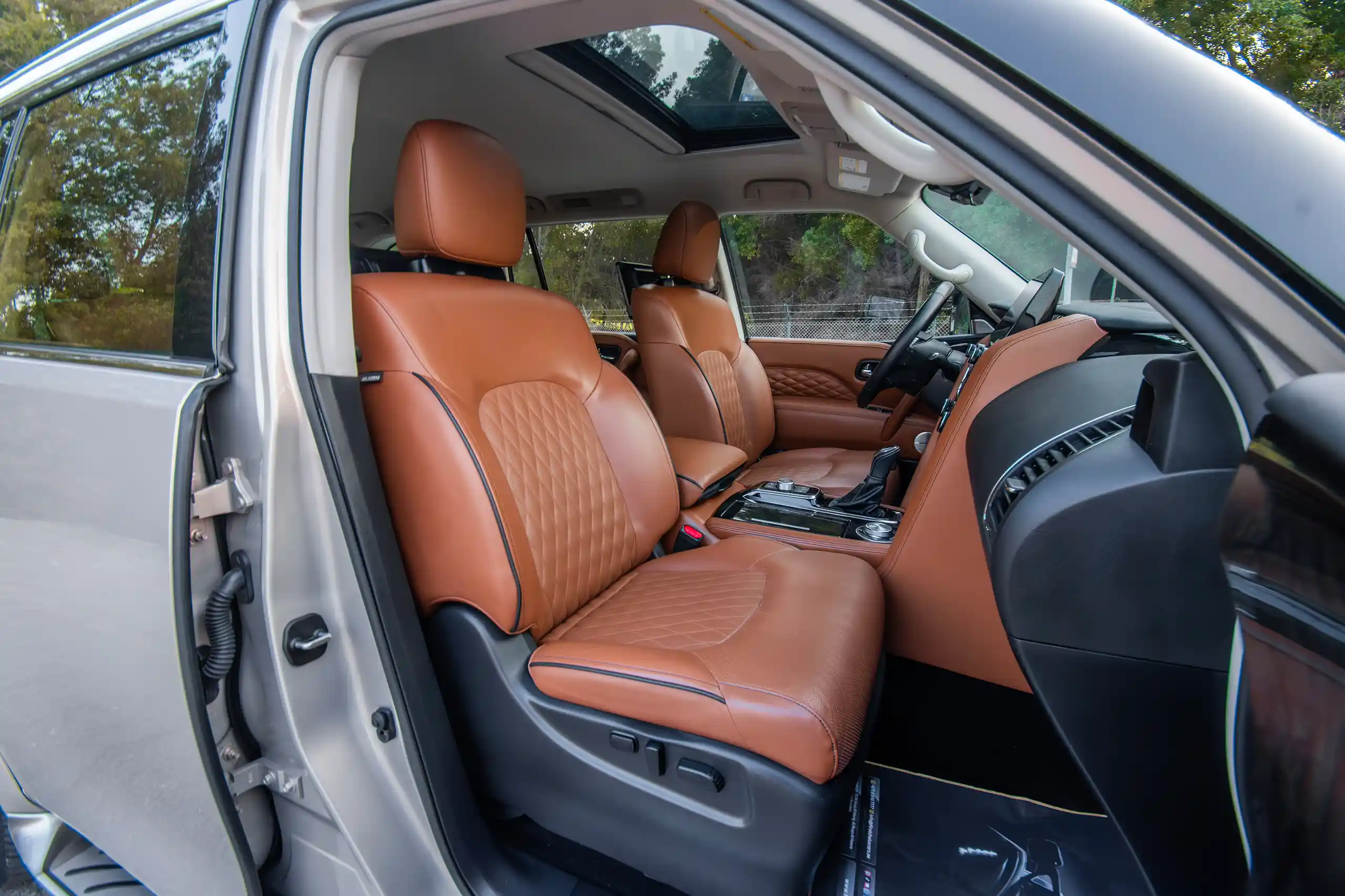 Used 2023 Infiniti QX80 Luxury Gold – Front Passenger Side Cabin View at First Choice Cars Sharjah