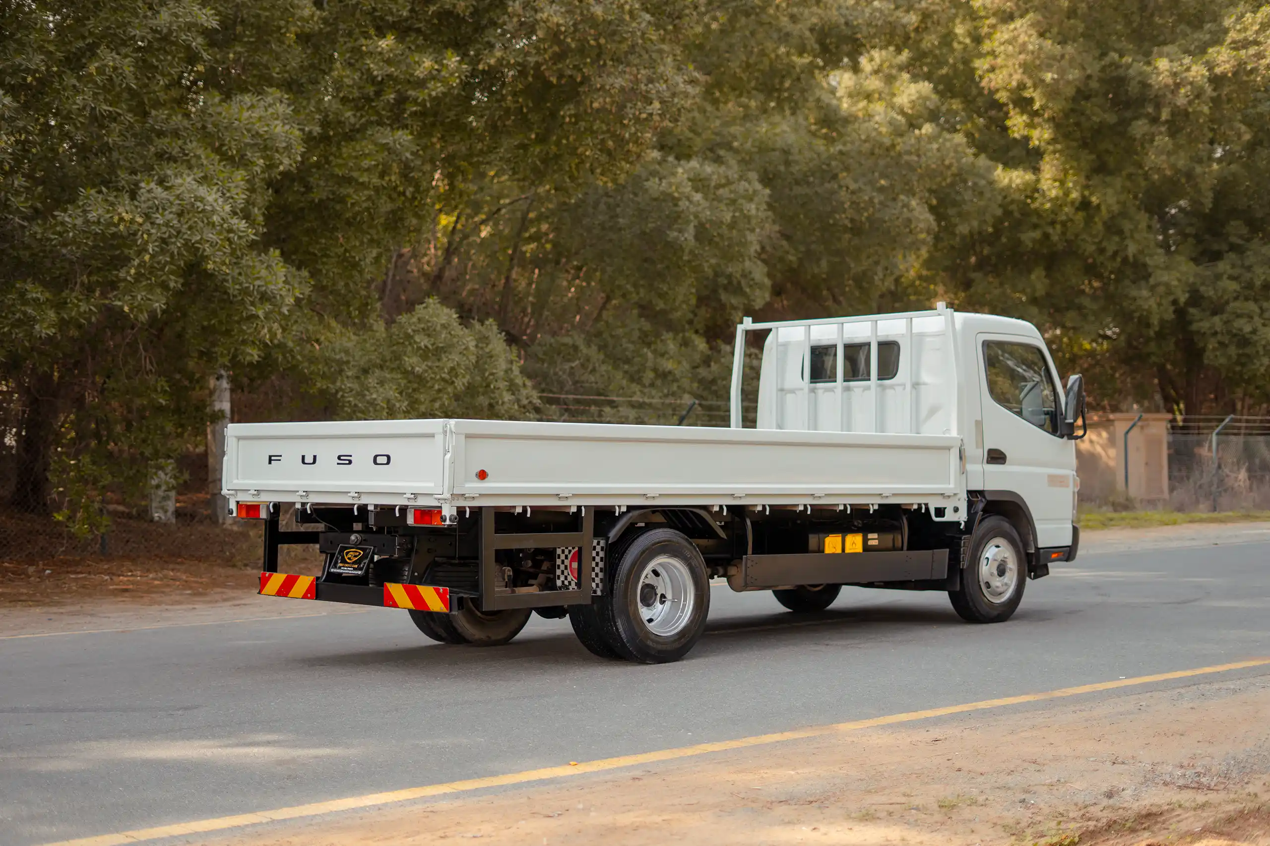 Used 2017 Mitsubishi Canter Cargo Body White – Right Back Diagonal (45°) View at First Choice Cars Sharjah